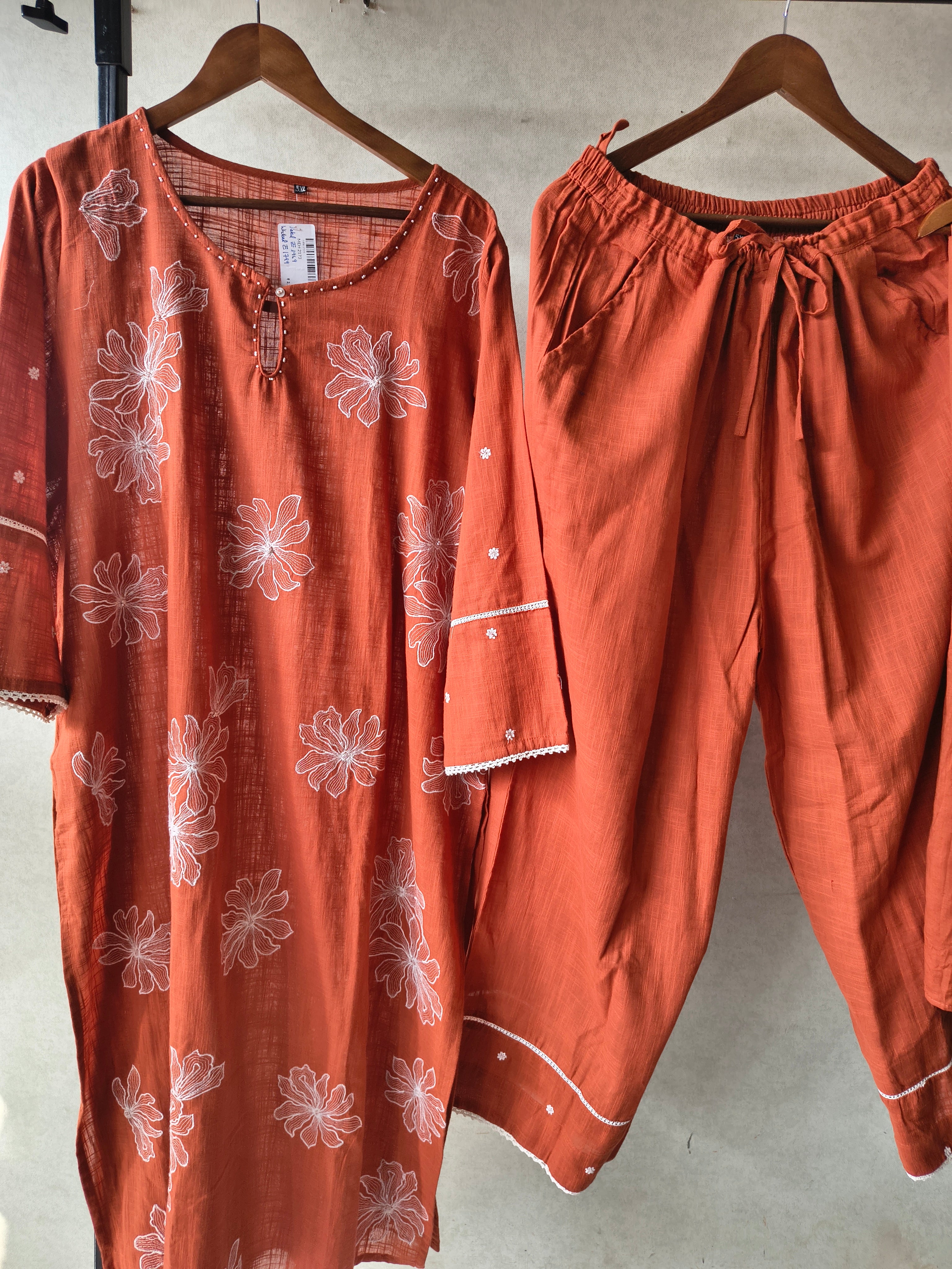 Image of Rust Orange Floral Printed Cotton Kurta Set with Solid Pants & Embroidered Dupatta