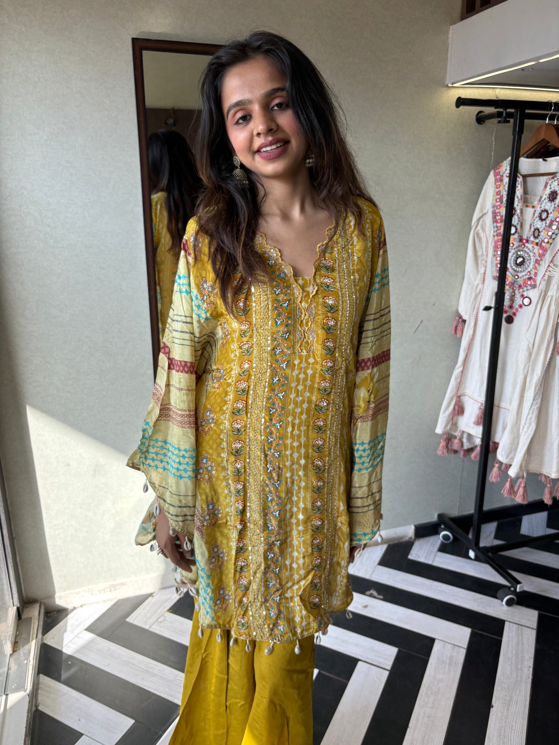 Crafted from pure crepe fabric with hand-sequenced accessory work - it's the sunshine outfit your wardrobe needs!