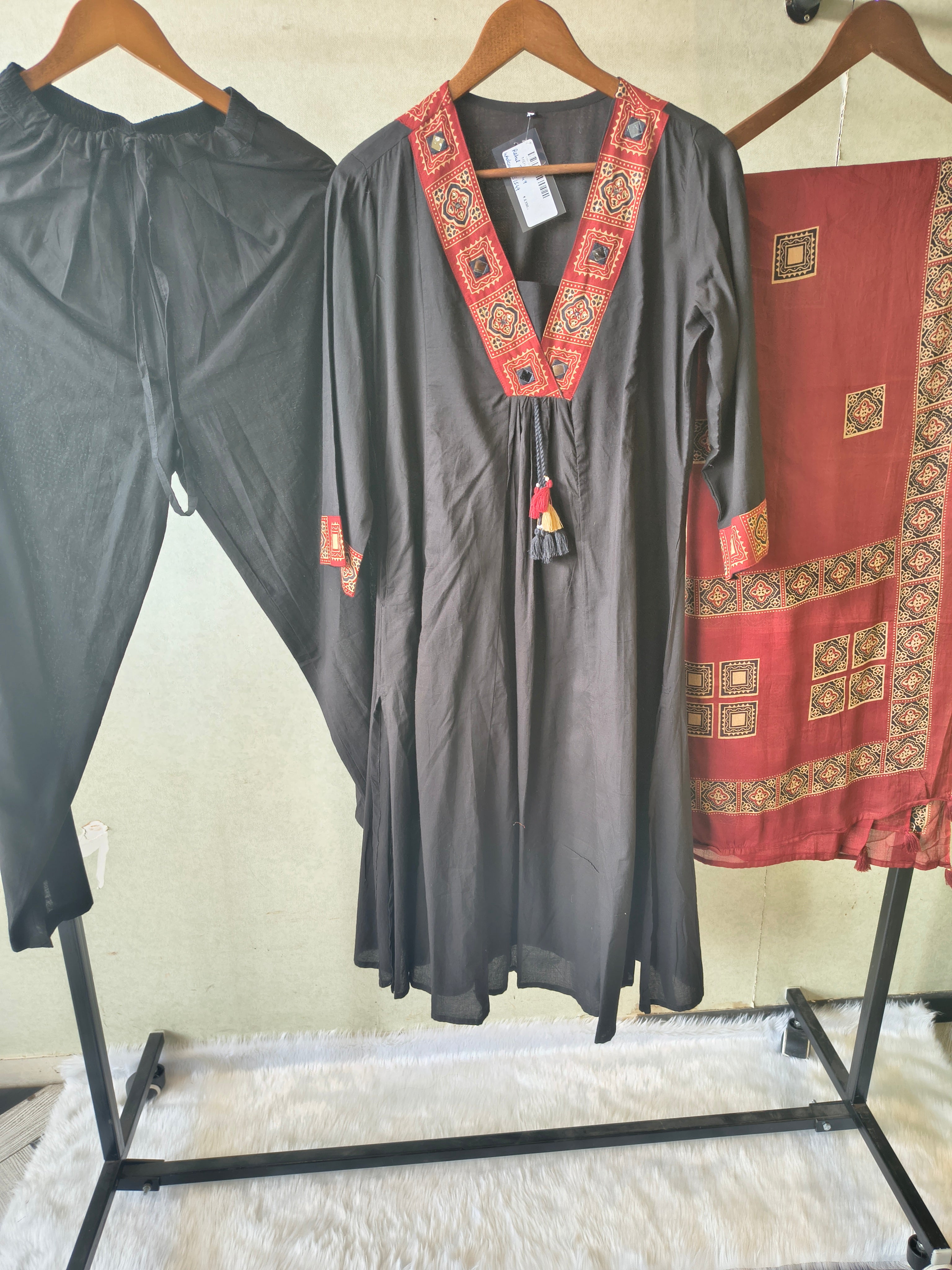 Image of Black Cotton Blend 3-Piece Suit Set with Tribal Printed V-Neck, Tassel Tie-Up & Printed Dupatta