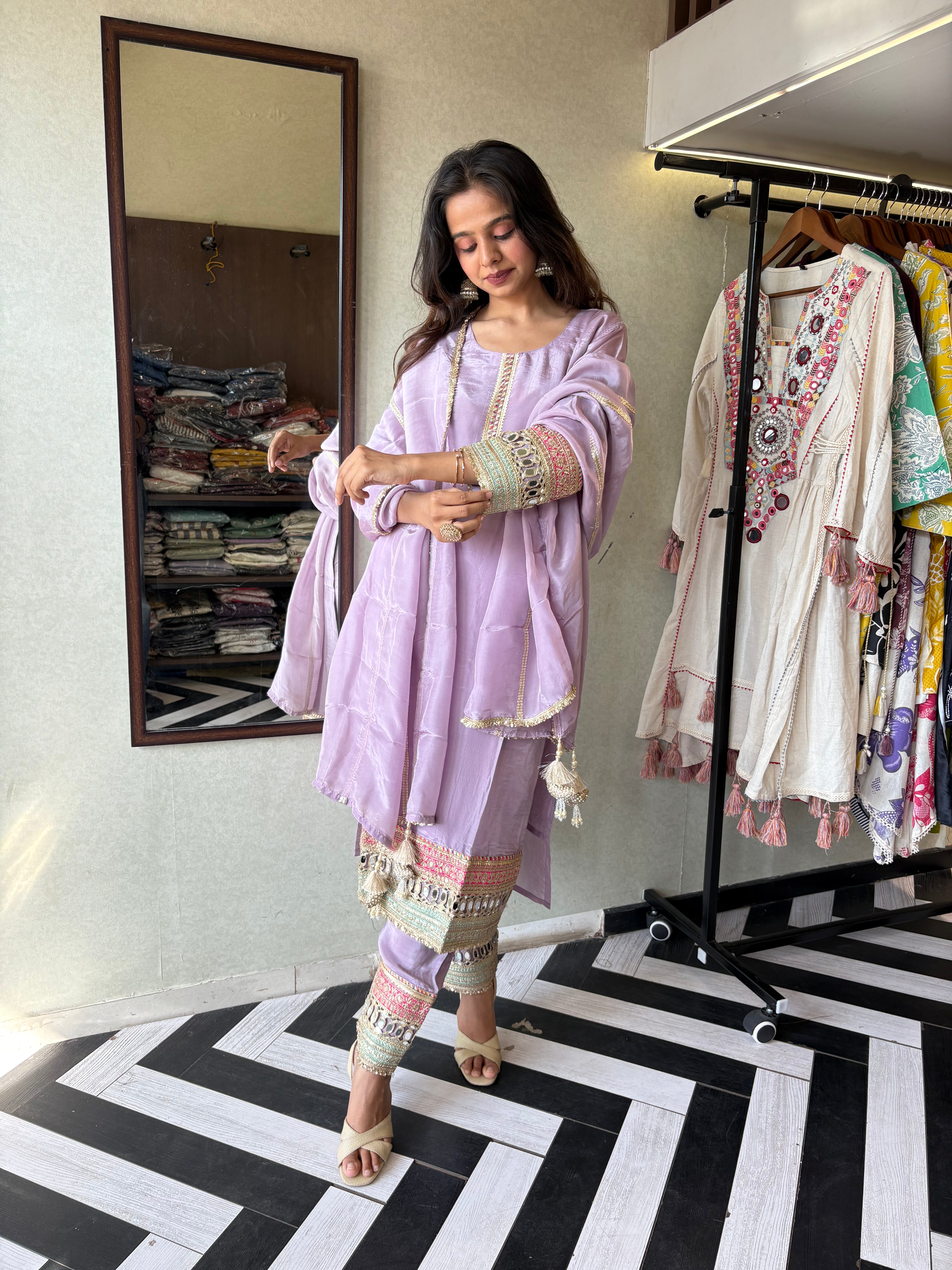Image of Shine Bright in Royal Magenta!

Crafted in pure silk crepe, this designer straight-cut kurti set is finished with mirror handwork on sleeves and pant ends - a perfect blend of subtle glam and timeless class.