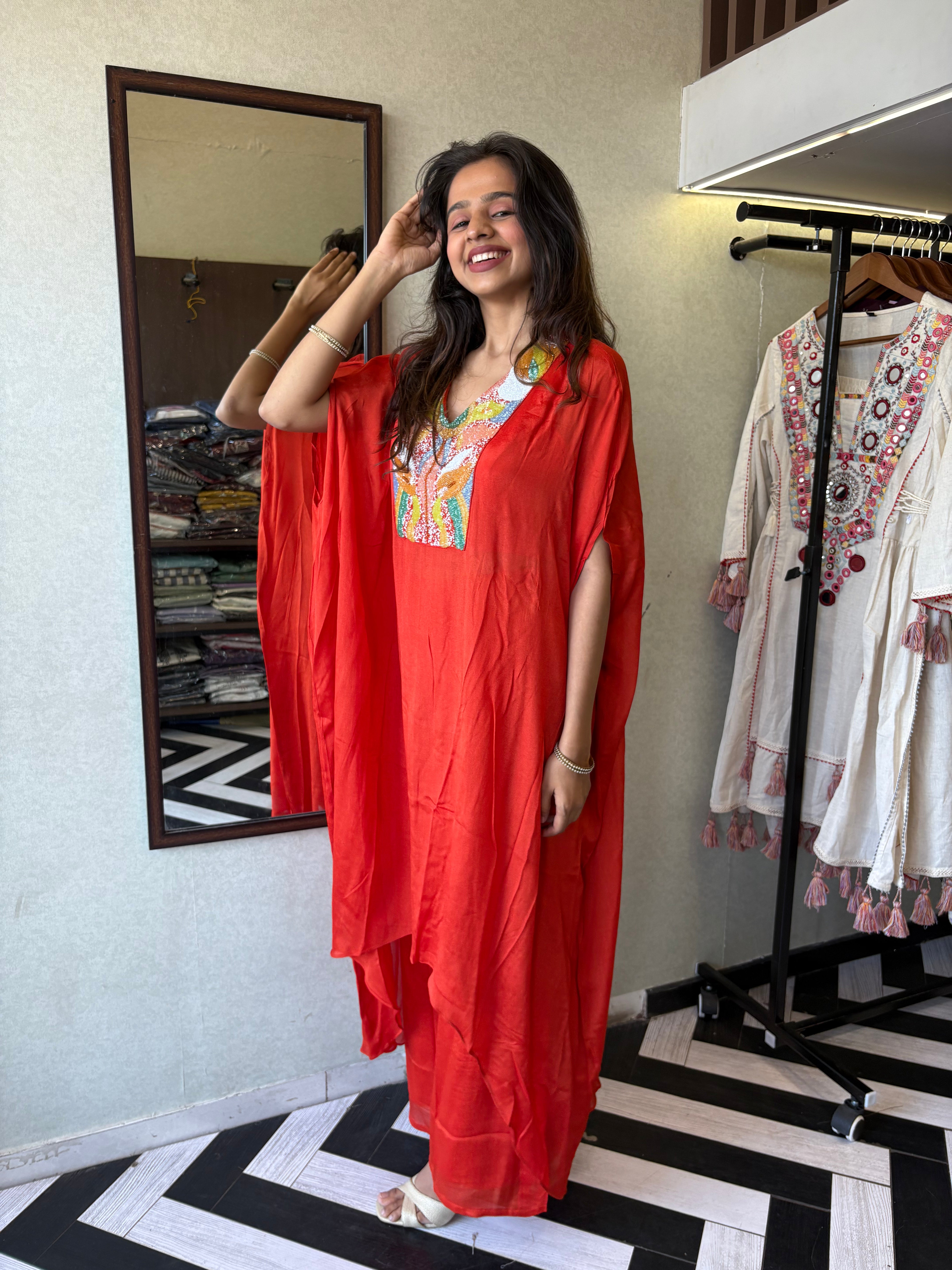 Image of Step into the spotlight in this premium 2-piece Indo-Western set in a breathtaking orange rust hue.