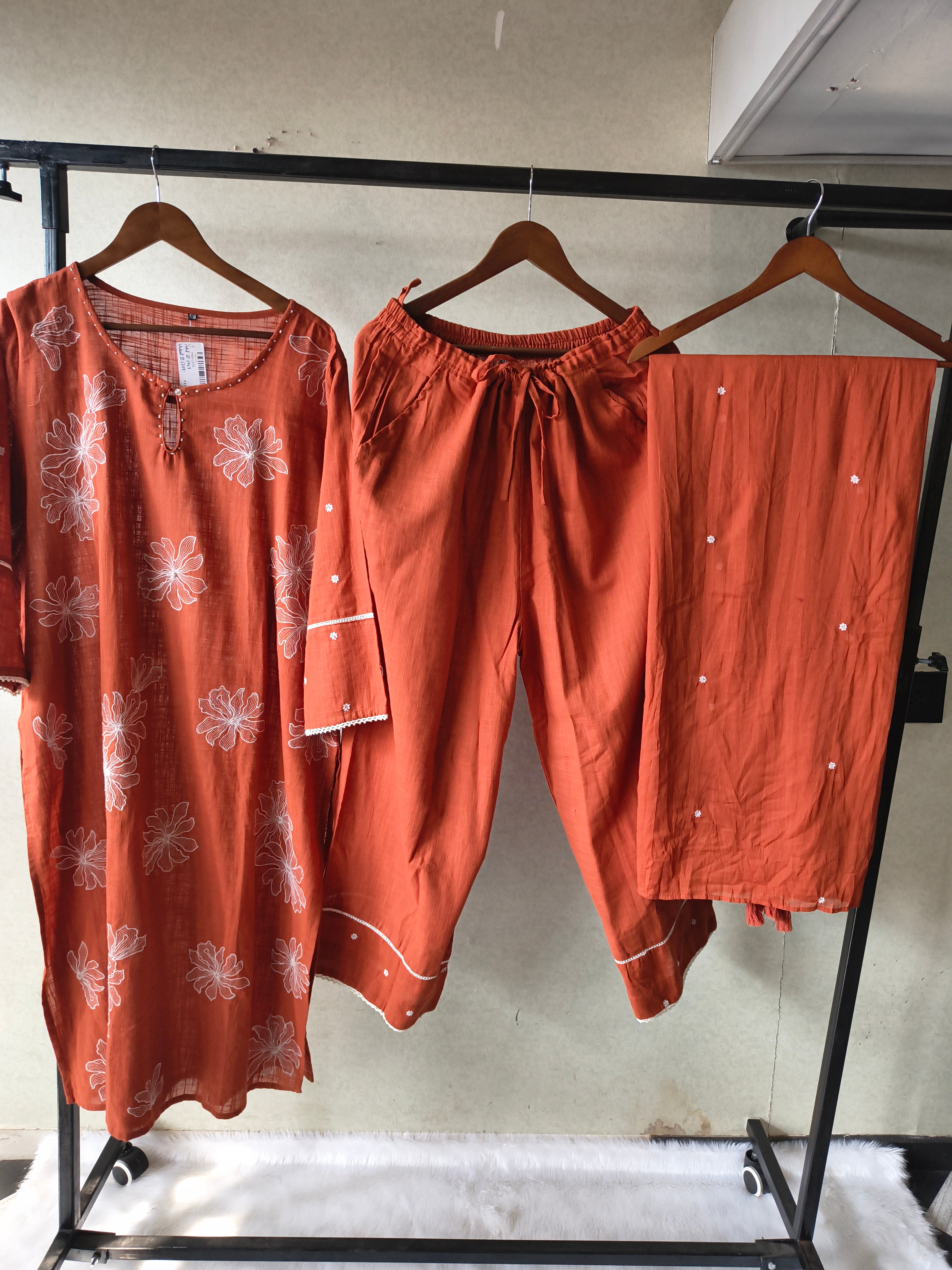 Image of Rust Orange Floral Printed Cotton Kurta Set with Solid Pants & Embroidered Dupatta