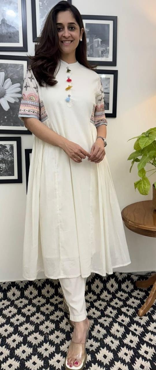 Aline kurta Style made from high-quality cotton flex, embellished with sequance embroidery work on hand sleeves and side line and paired with matching pant.