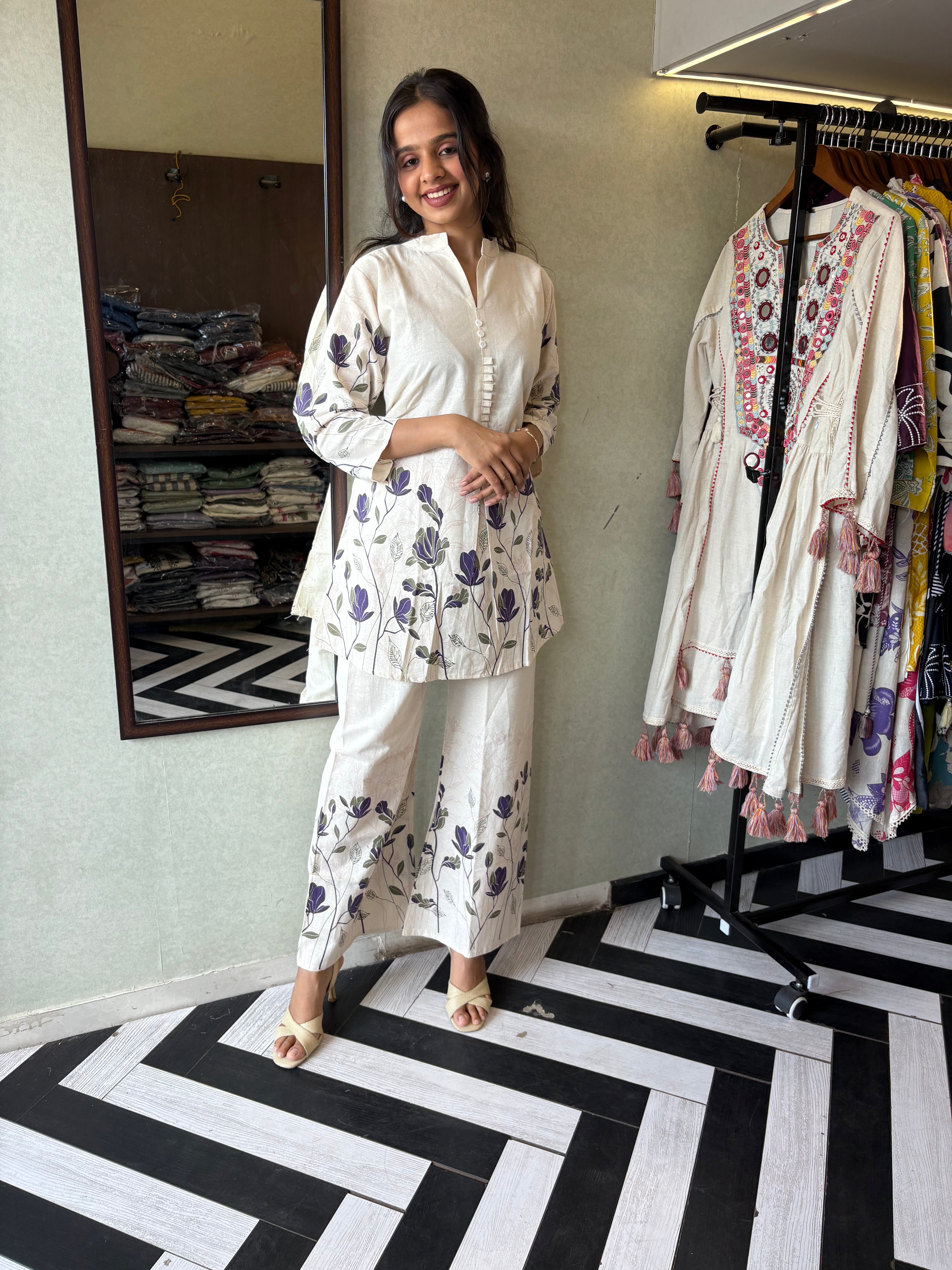 Image of This pure cotton co-ord set in a designer white print is your summer savior - soft on the skin, bold on fashion