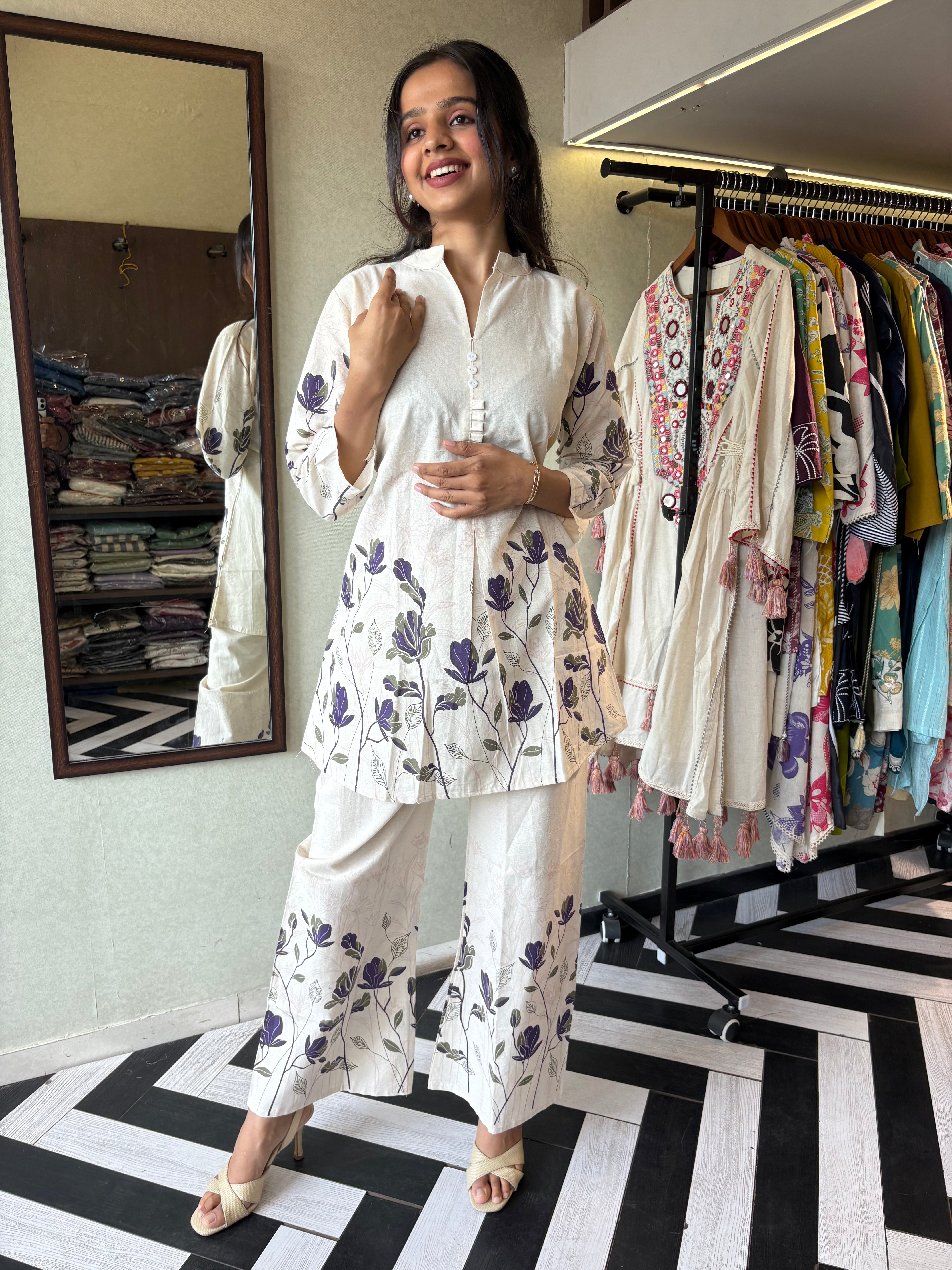 This pure cotton co-ord set in a designer white print is your summer savior - soft on the skin, bold on fashion