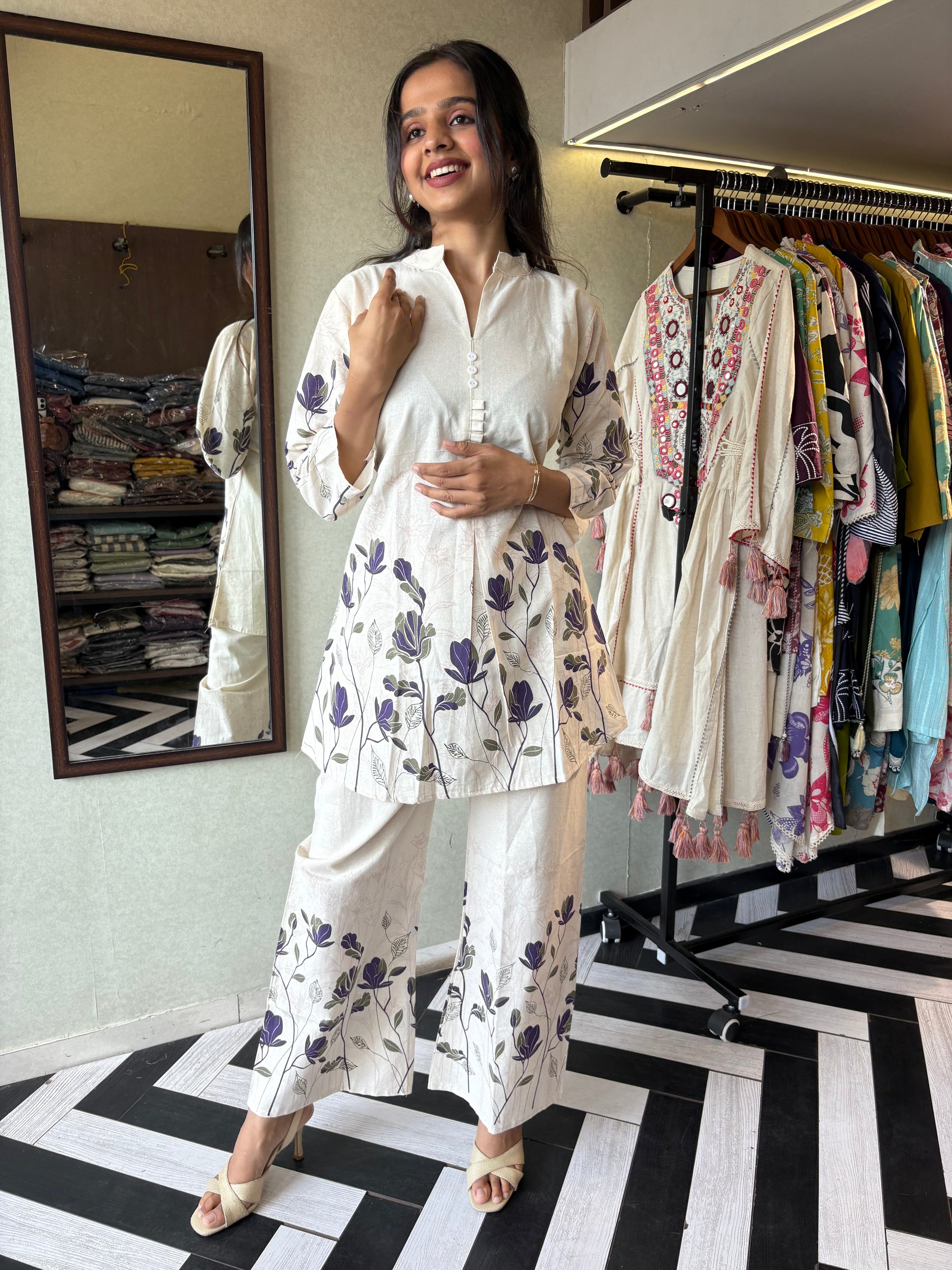 This pure cotton co-ord set in a designer white print is your summer savior - soft on the skin, bold on fashion