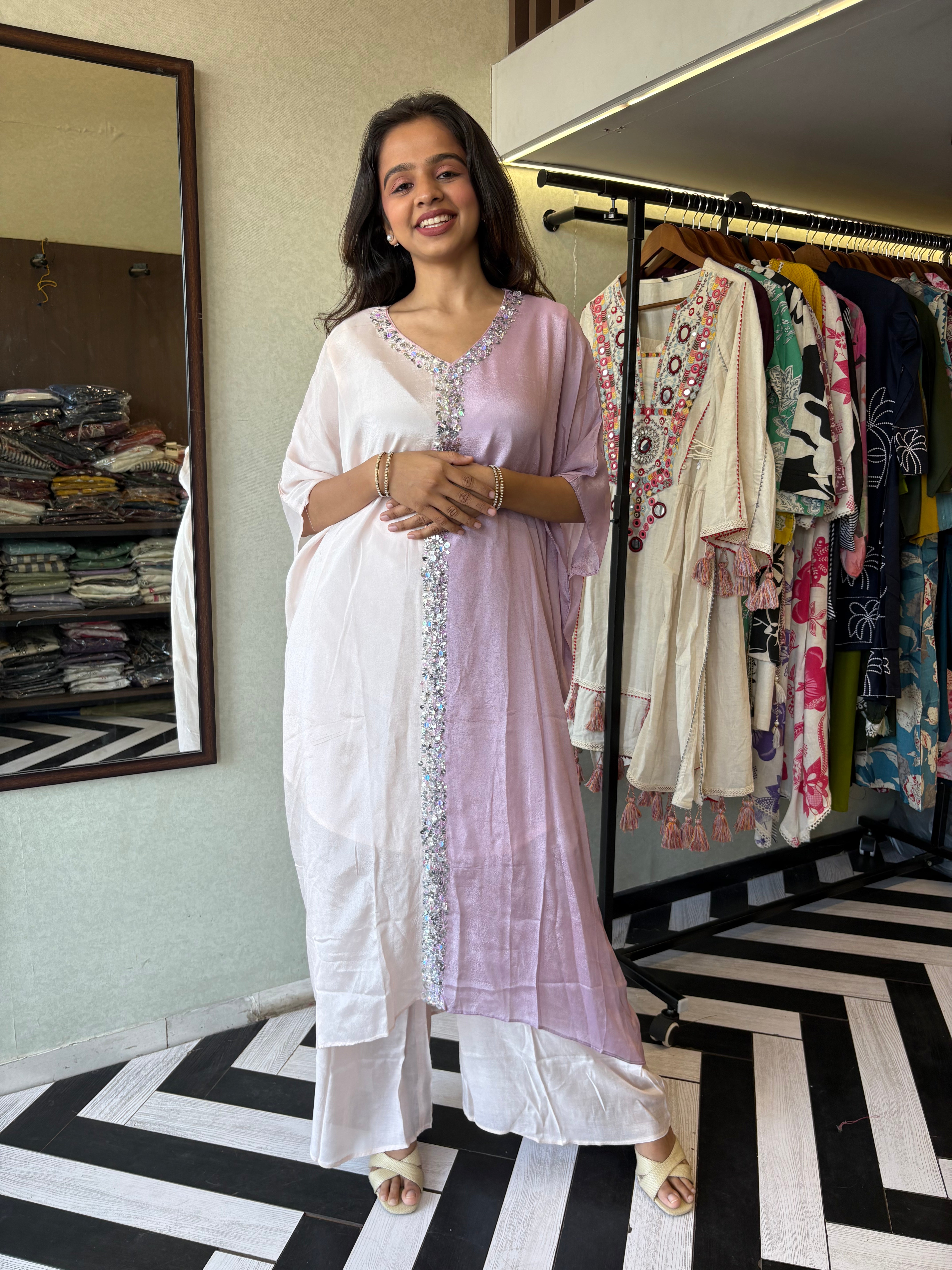 Turn heads in this elegant 3-piece Indo-Western beauty crafted from pure crepe with a silk base - featuring:

Gorgeous double-shade rose color

Center hand-sequence work that glistens with grace