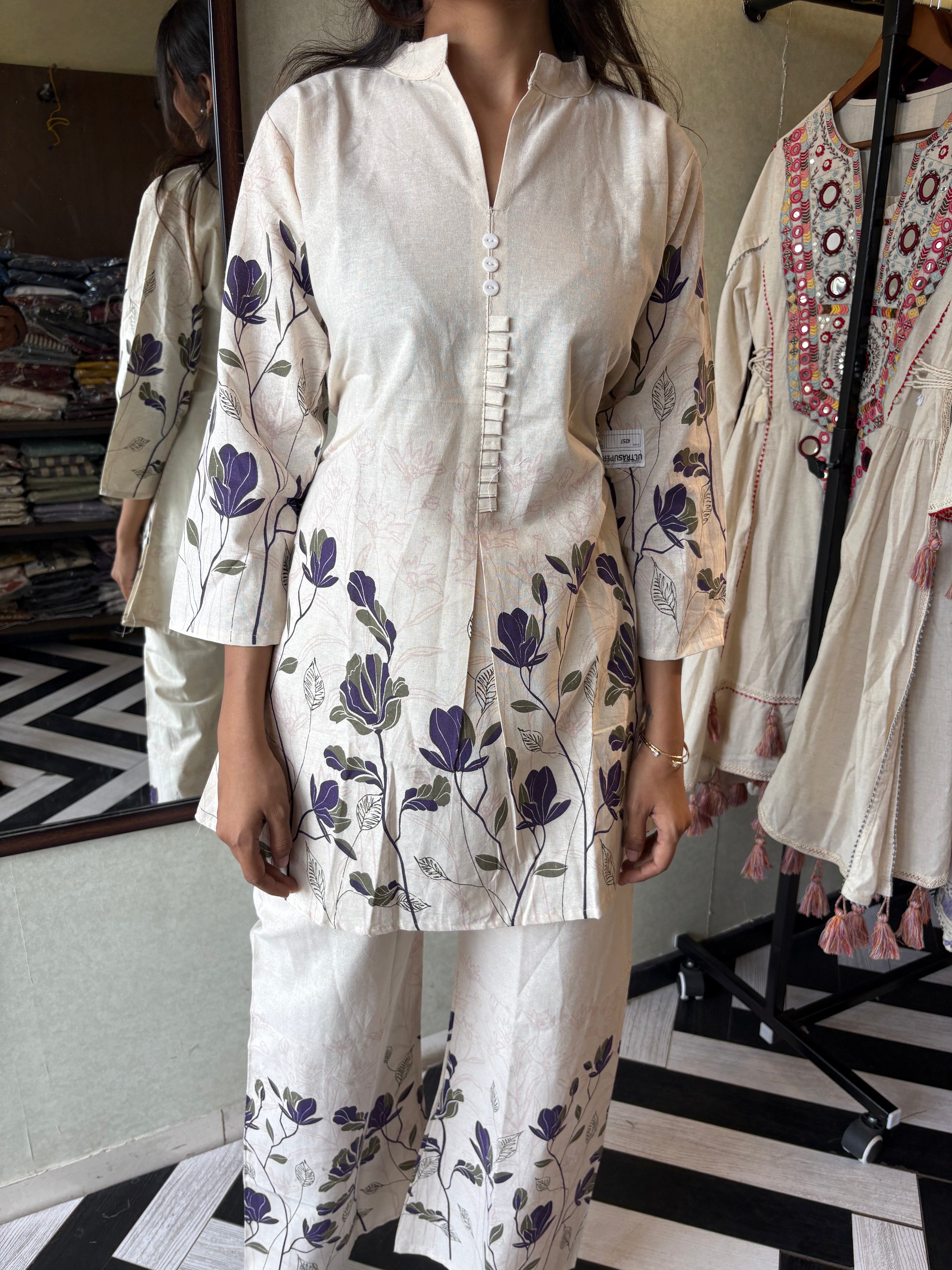 Image of This pure cotton co-ord set in a designer white print is your summer savior - soft on the skin, bold on fashion
