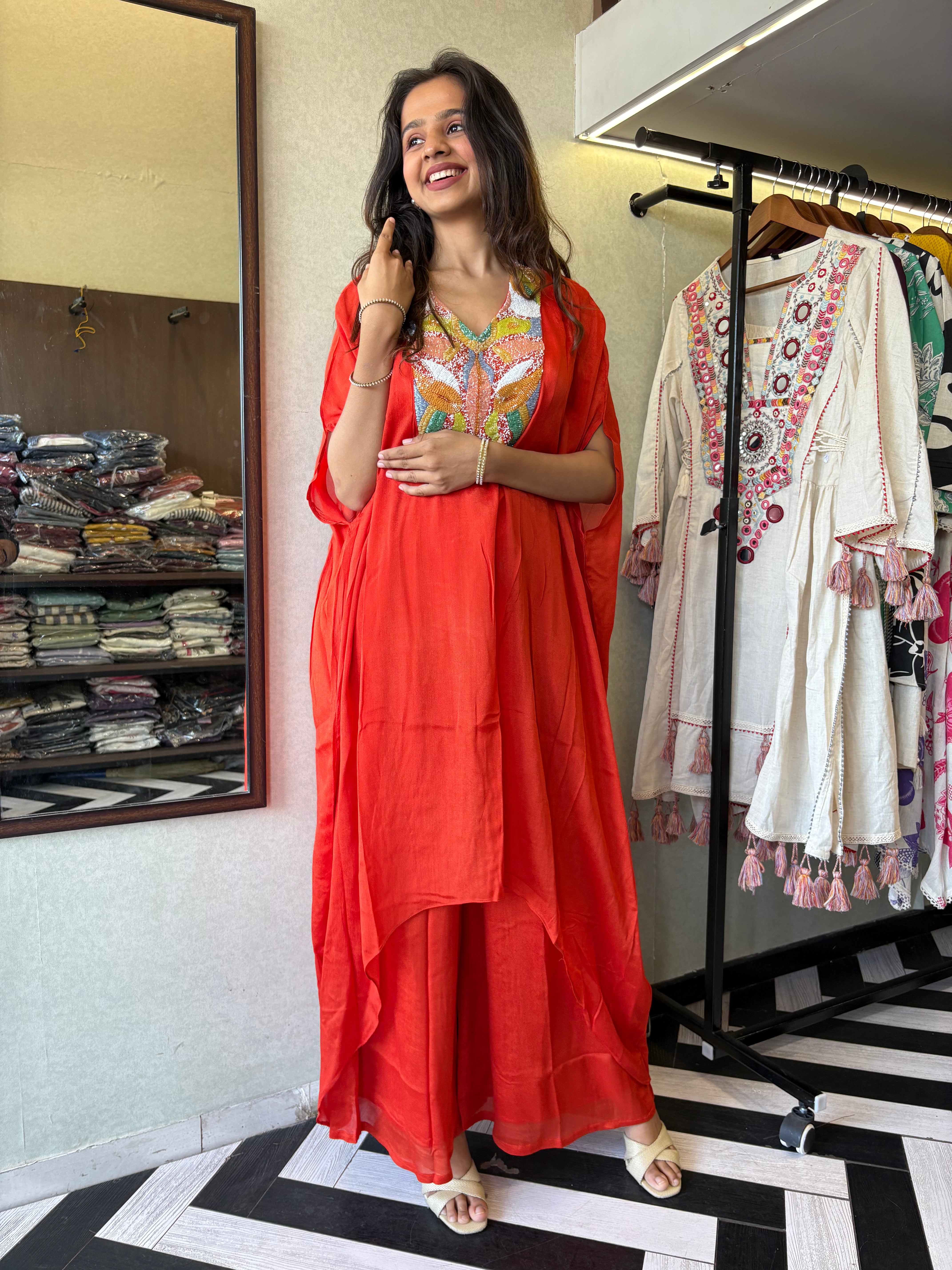 Image of Step into the spotlight in this premium 2-piece Indo-Western set in a breathtaking orange rust hue.