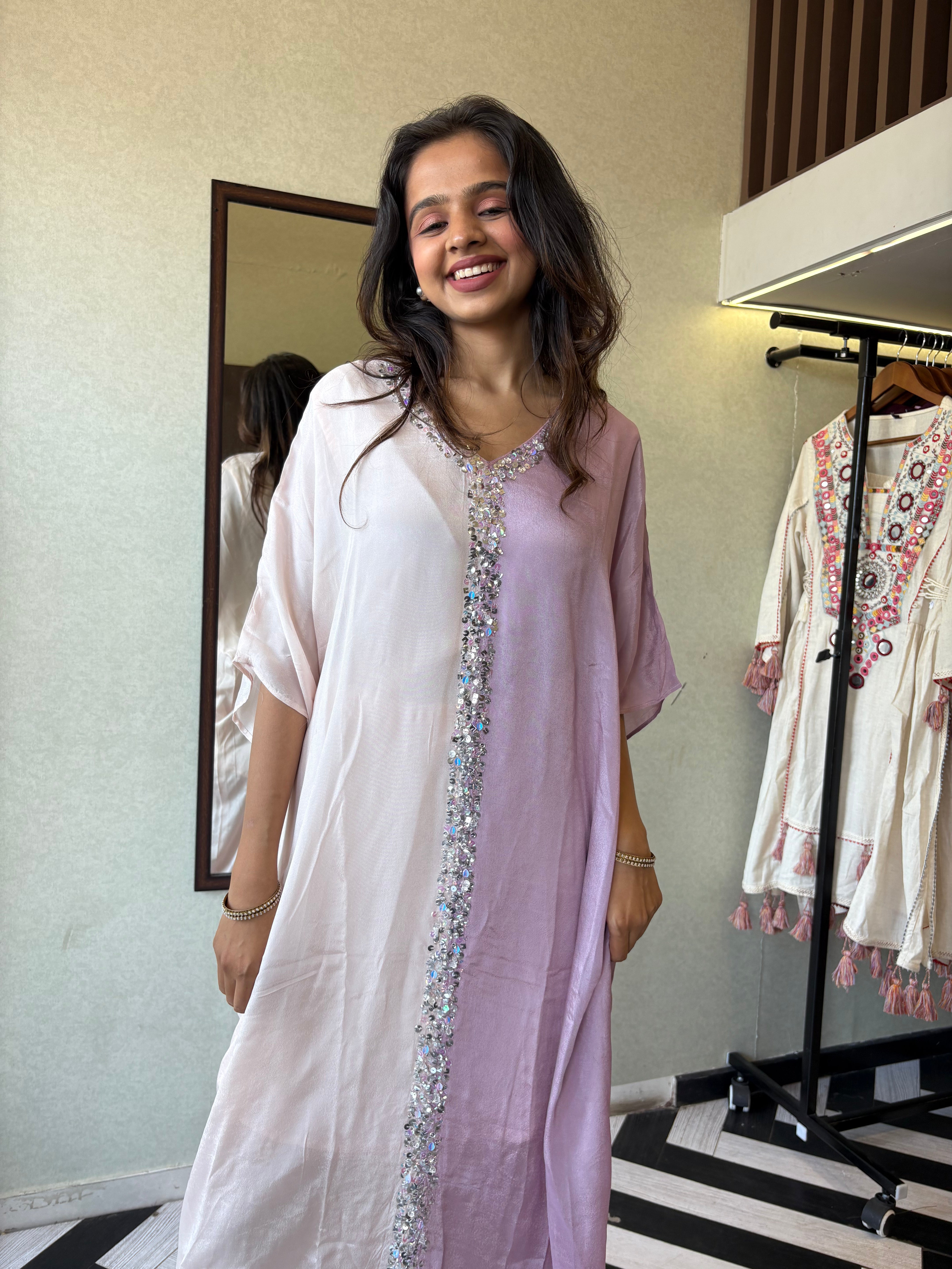 Turn heads in this elegant 3-piece Indo-Western beauty crafted from pure crepe with a silk base - featuring:

Gorgeous double-shade rose color

Center hand-sequence work that glistens with grace