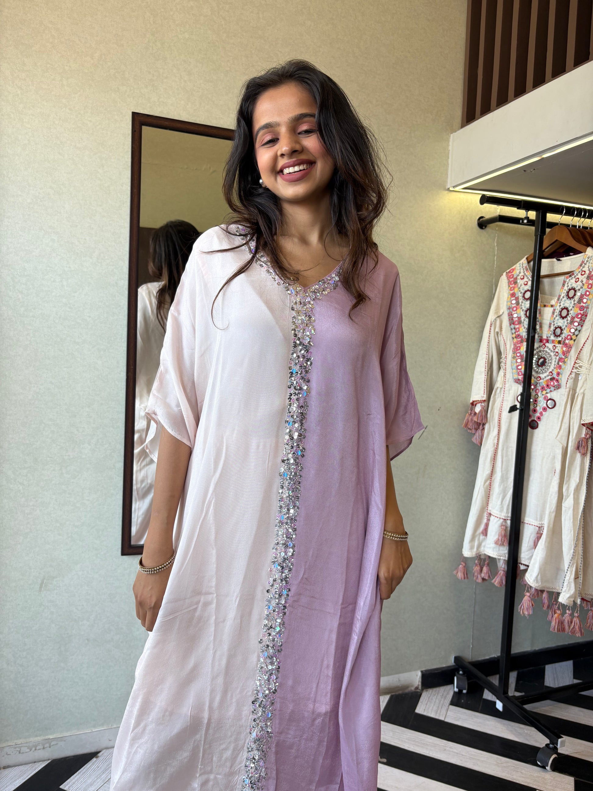 Turn heads in this elegant 3-piece Indo-Western beauty crafted from pure crepe with a silk base - featuring:

Gorgeous double-shade rose color

Center hand-sequence work that glistens with grace