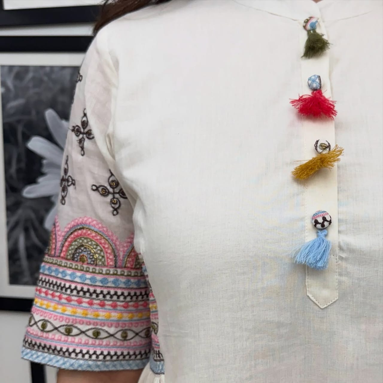 Aline kurta Style made from high-quality cotton flex, embellished with sequance embroidery work on hand sleeves and side line and paired with matching pant.