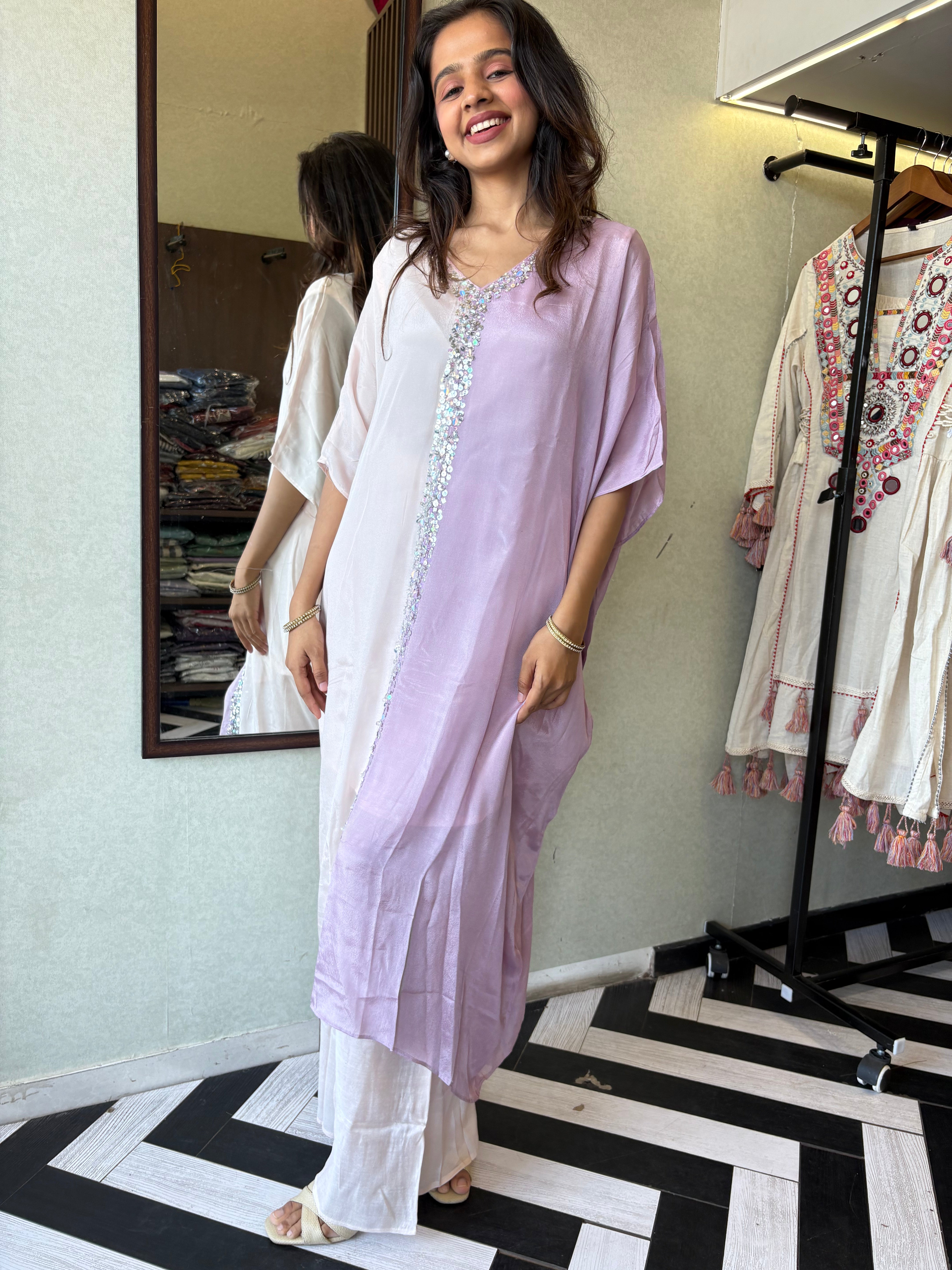 Image of Turn heads in this elegant 3-piece Indo-Western beauty crafted from pure crepe with a silk base - featuring:

Gorgeous double-shade rose color

Center hand-sequence work that glistens with grace