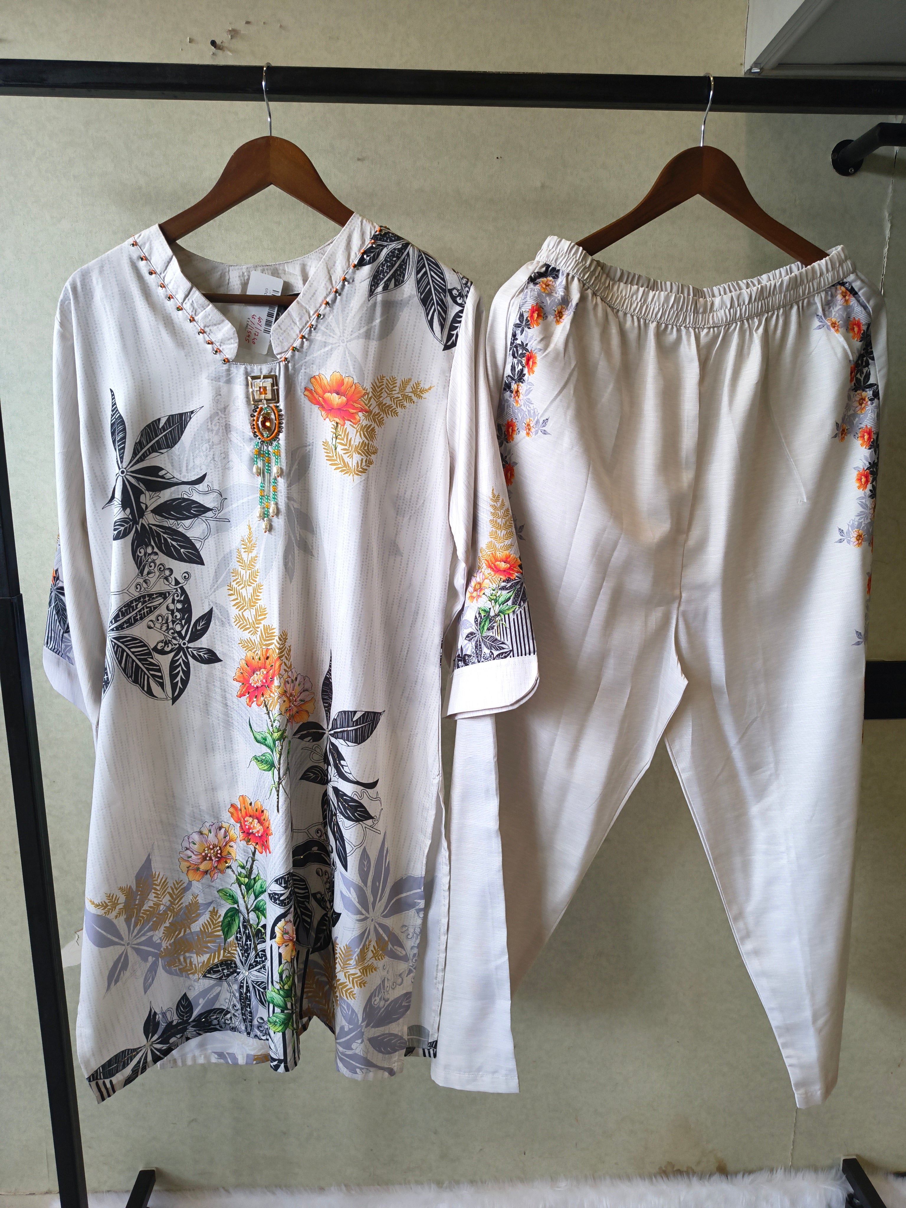 Image of Premium Ivory Botanical Printed Kurta Set with Designer Pendant Neckline