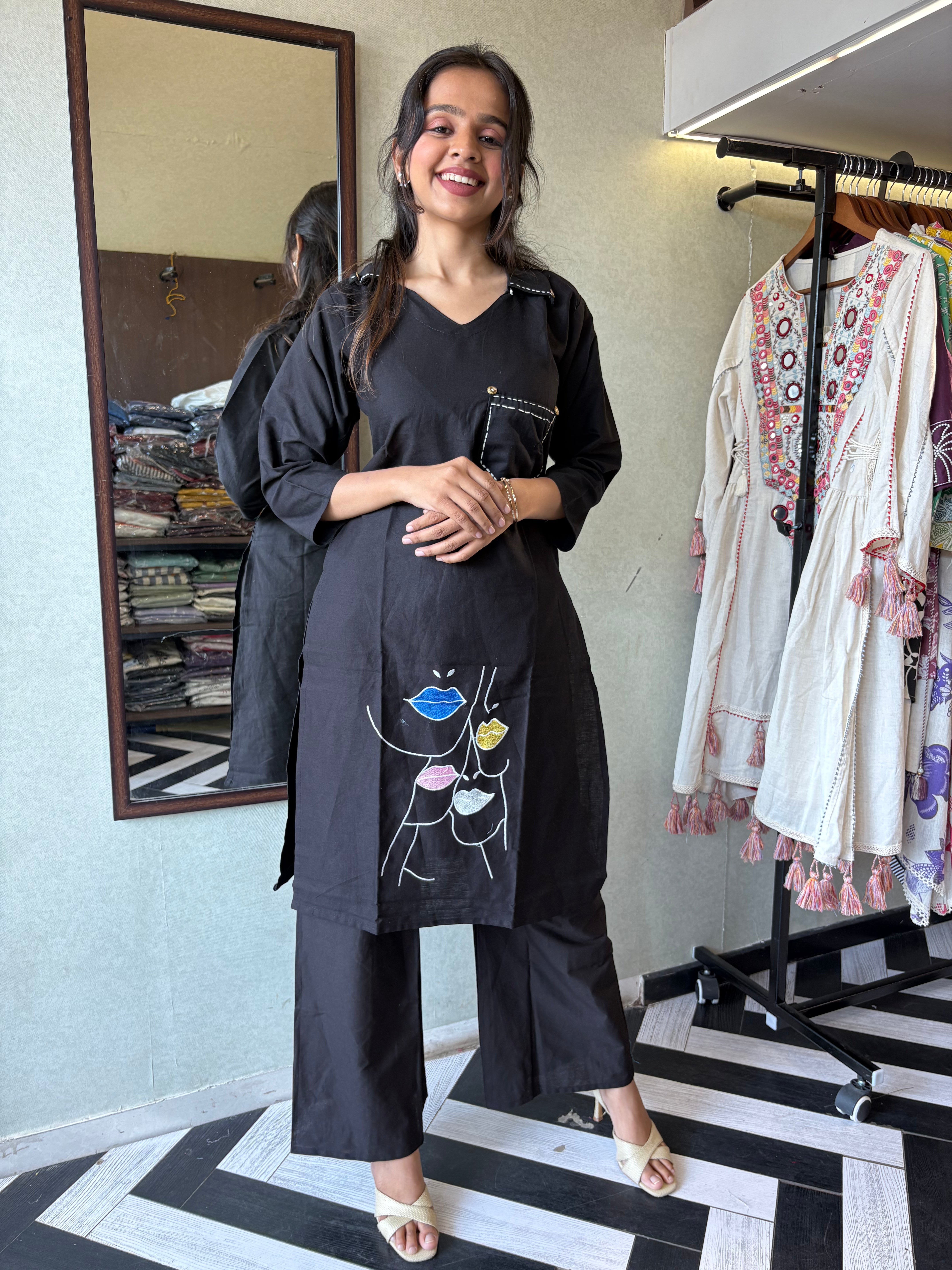 pure cotton black co-ord set, elevated with elegant embroidery detailing. It's a wardrobe must-have that looks premium