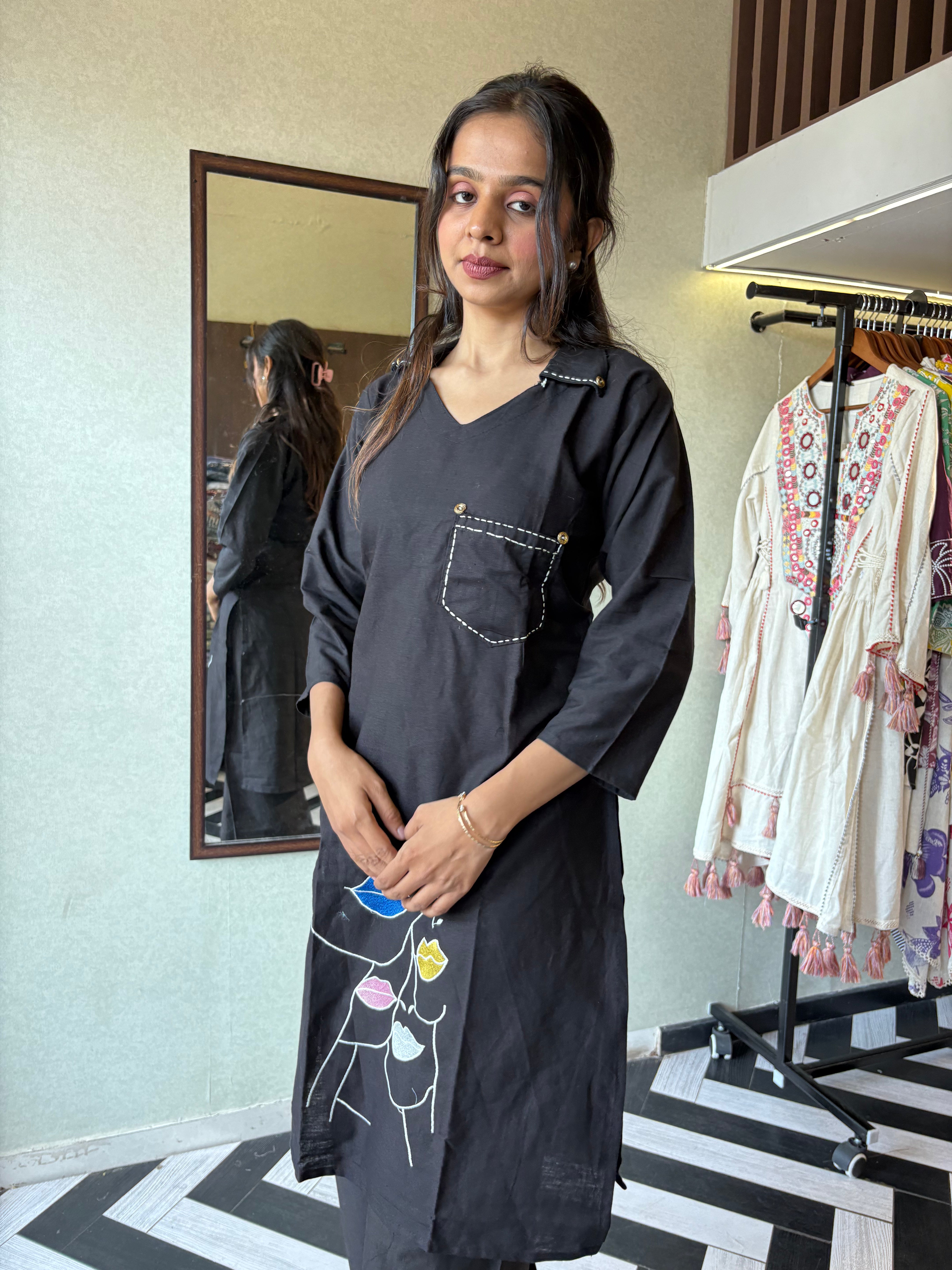 Image of pure cotton black co-ord set, elevated with elegant embroidery detailing. It's a wardrobe must-have that looks premium