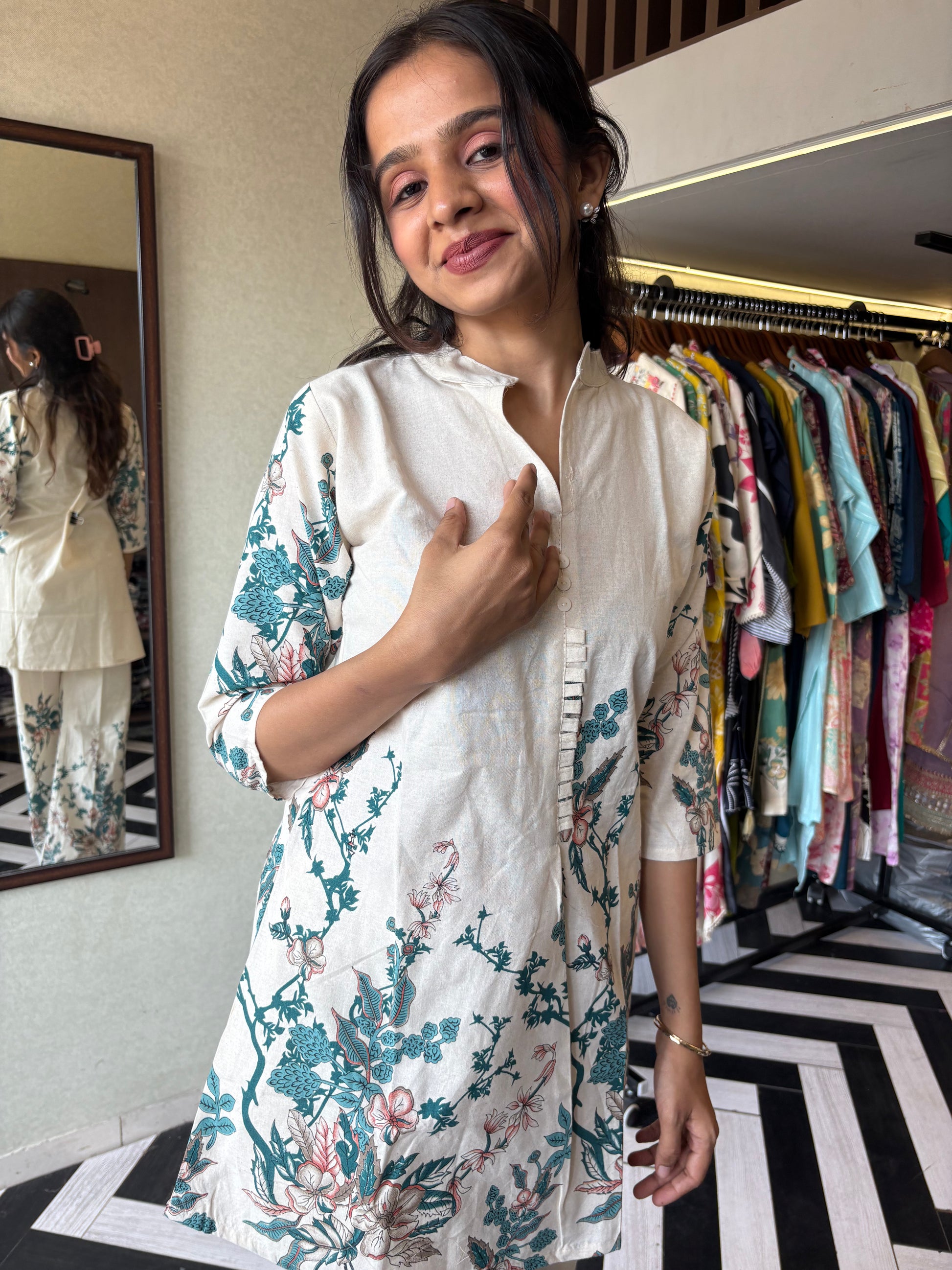 This pure cotton co-ord set in a designer white print is your summer savior - soft on the skin, bold on fashion