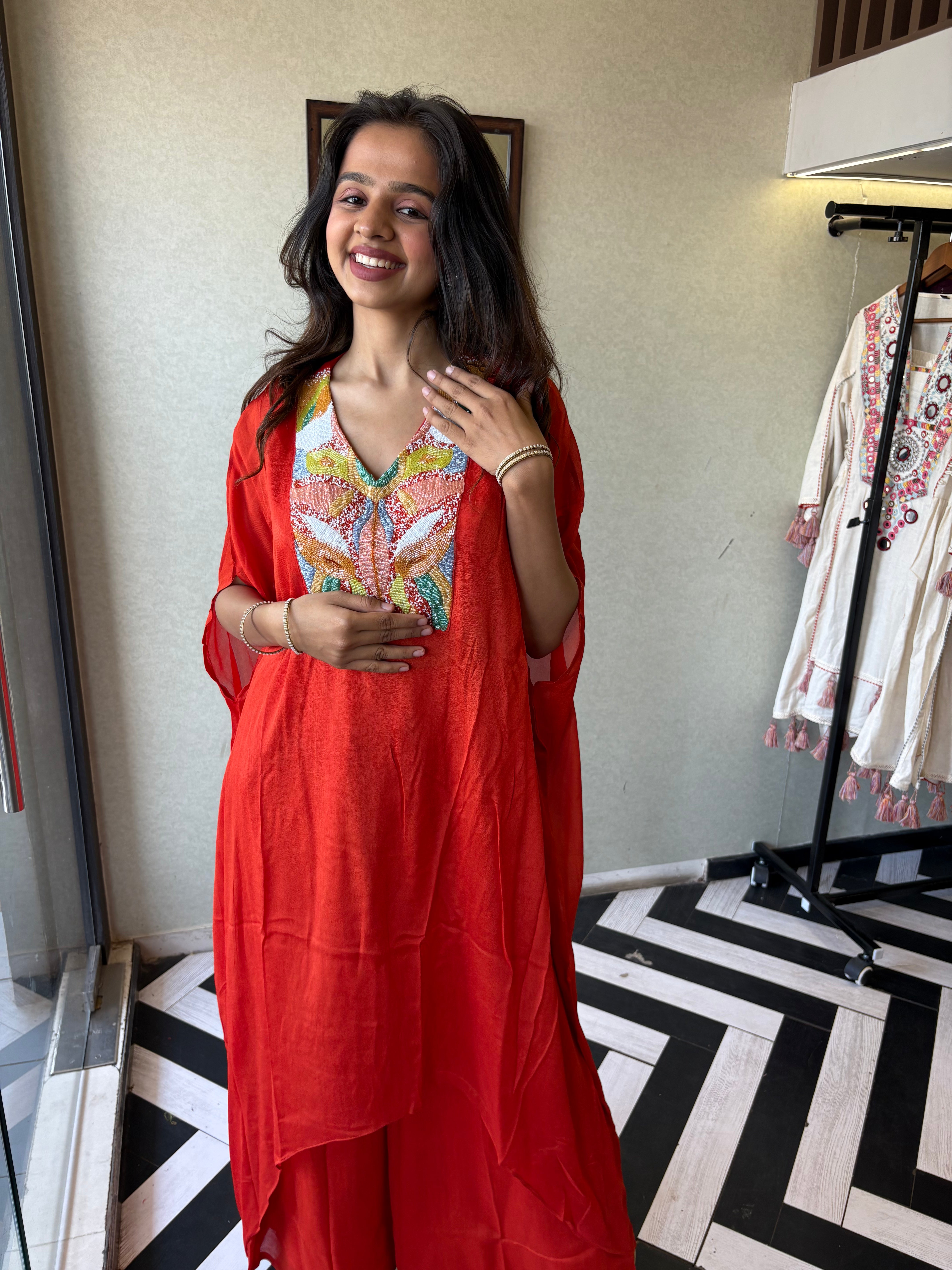 Image of Step into the spotlight in this premium 2-piece Indo-Western set in a breathtaking orange rust hue.