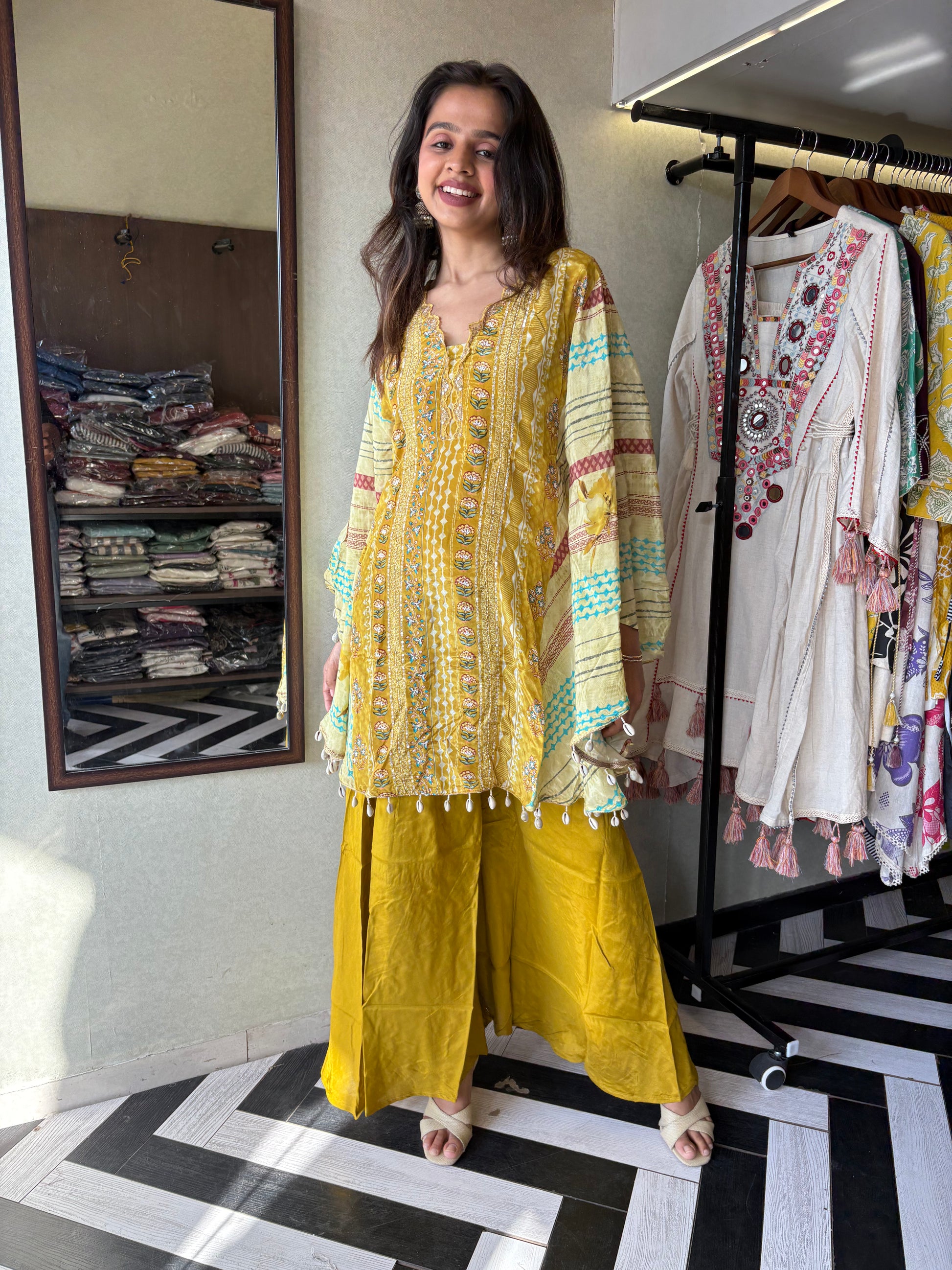 Crafted from pure crepe fabric with hand-sequenced accessory work - it's the sunshine outfit your wardrobe needs!