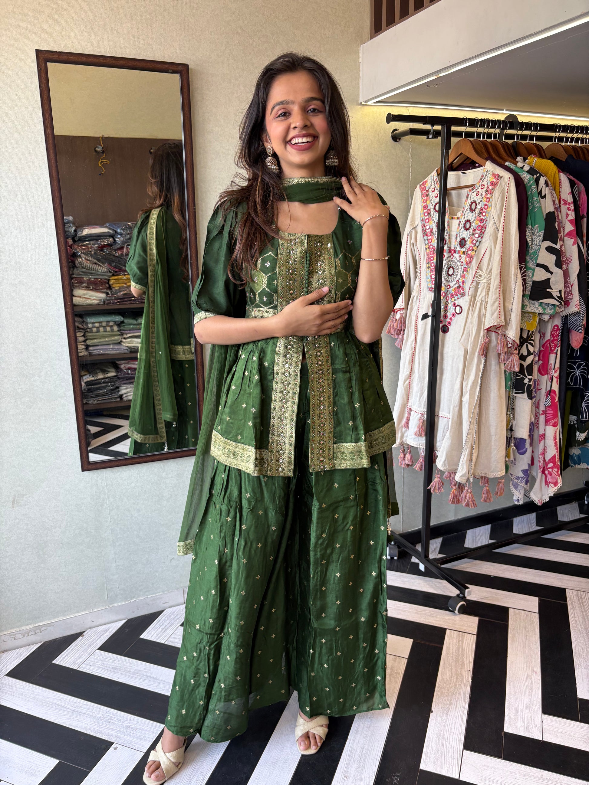 our premium pure silk 3-piece Indo-Western set in stunning green! From dazzling mirror & handwork on the jacket-style top to the flowing plazzo and dupatta