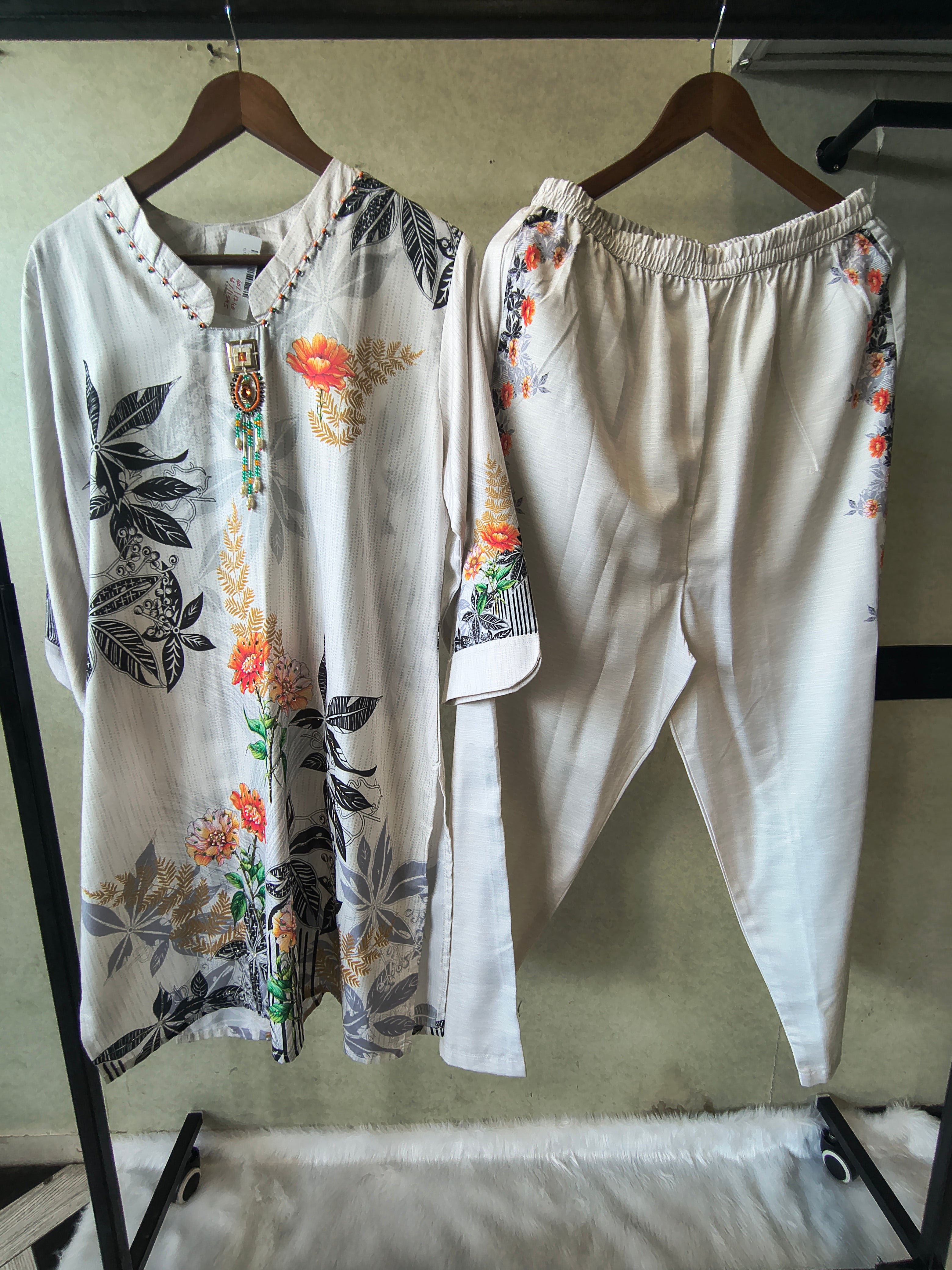 Image of Premium Ivory Botanical Printed Kurta Set with Designer Pendant Neckline