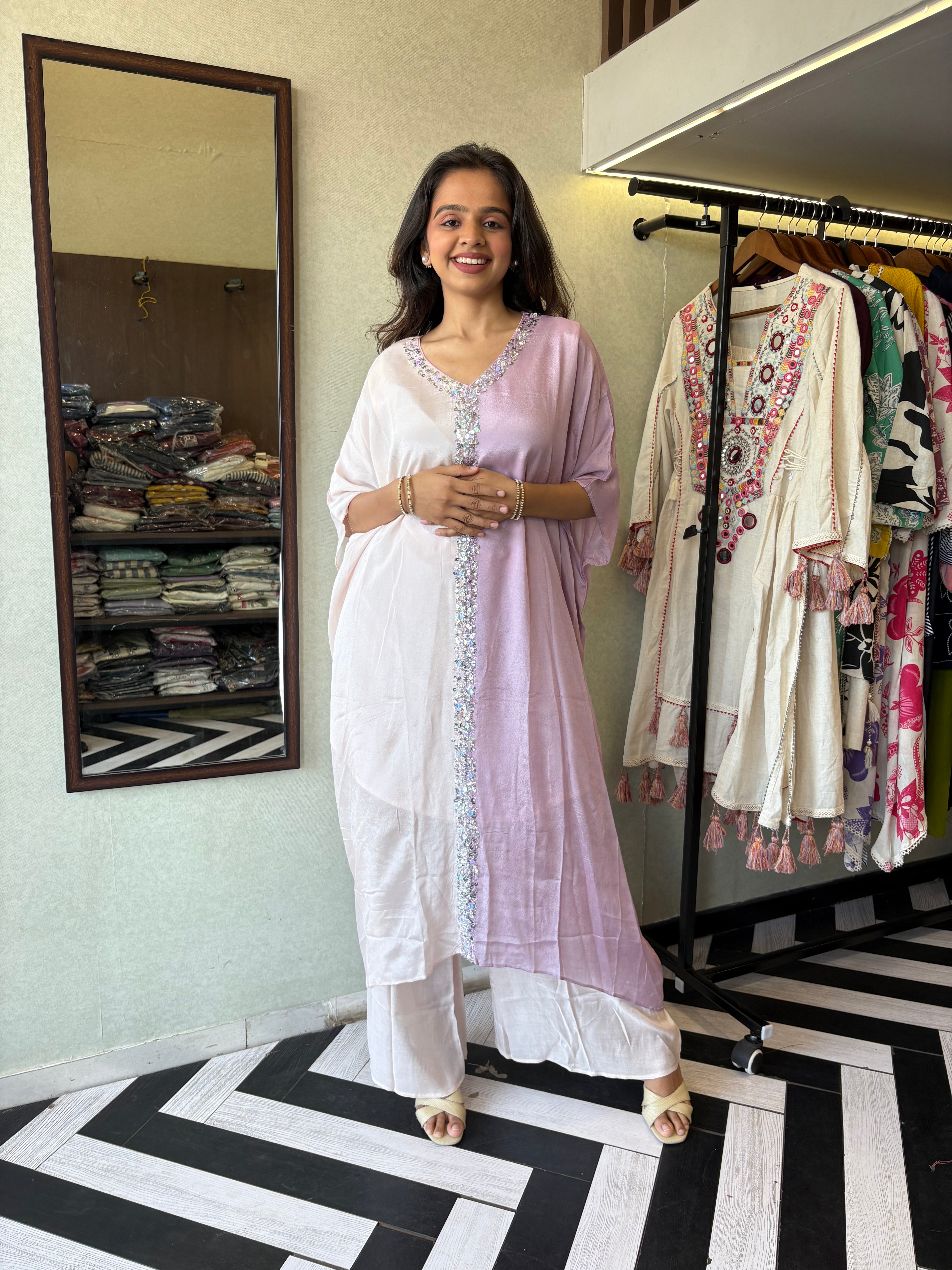 Image of Turn heads in this elegant 3-piece Indo-Western beauty crafted from pure crepe with a silk base - featuring:

Gorgeous double-shade rose color

Center hand-sequence work that glistens with grace