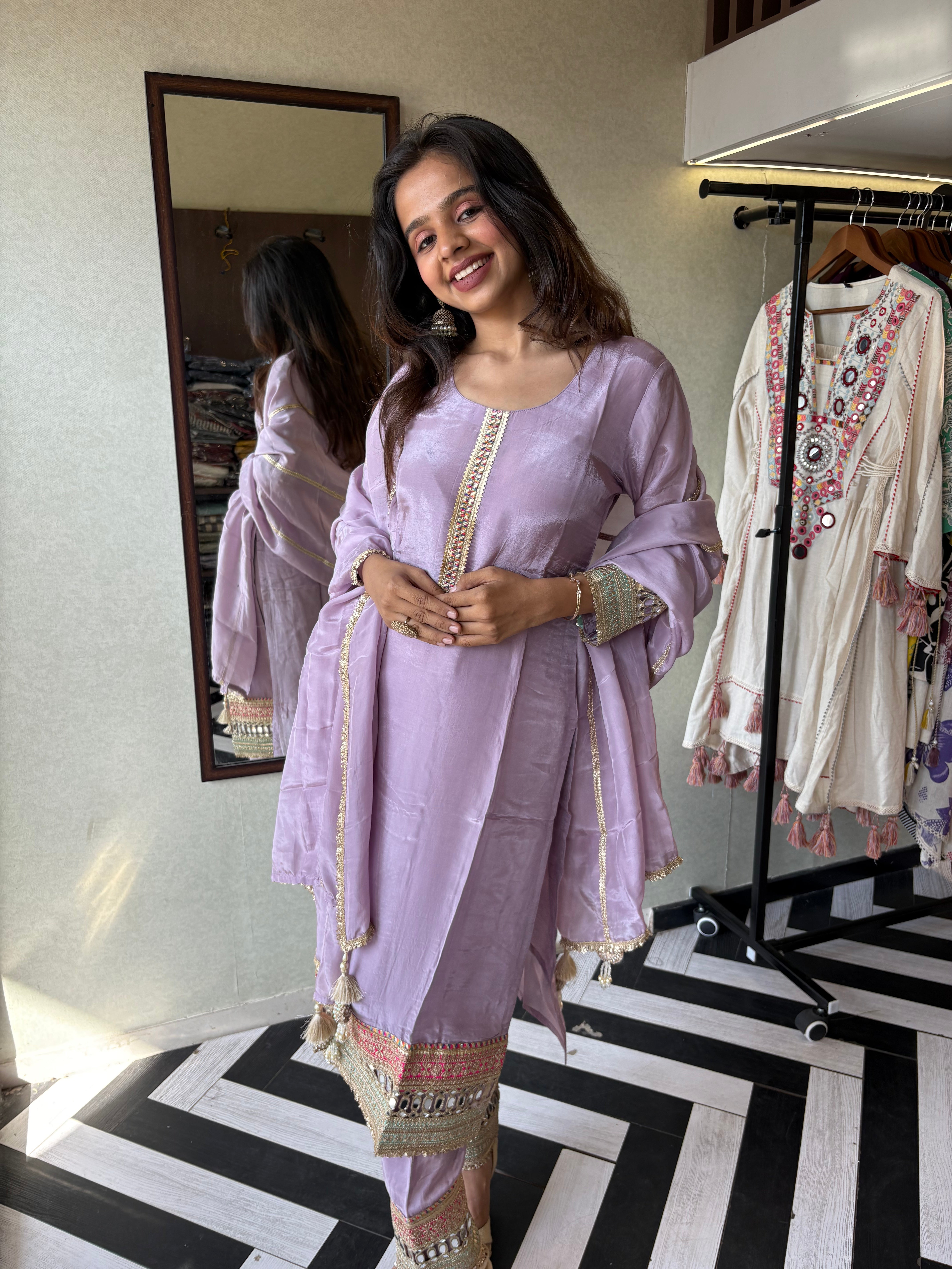 Image of Shine Bright in Royal Magenta!

Crafted in pure silk crepe, this designer straight-cut kurti set is finished with mirror handwork on sleeves and pant ends - a perfect blend of subtle glam and timeless class.