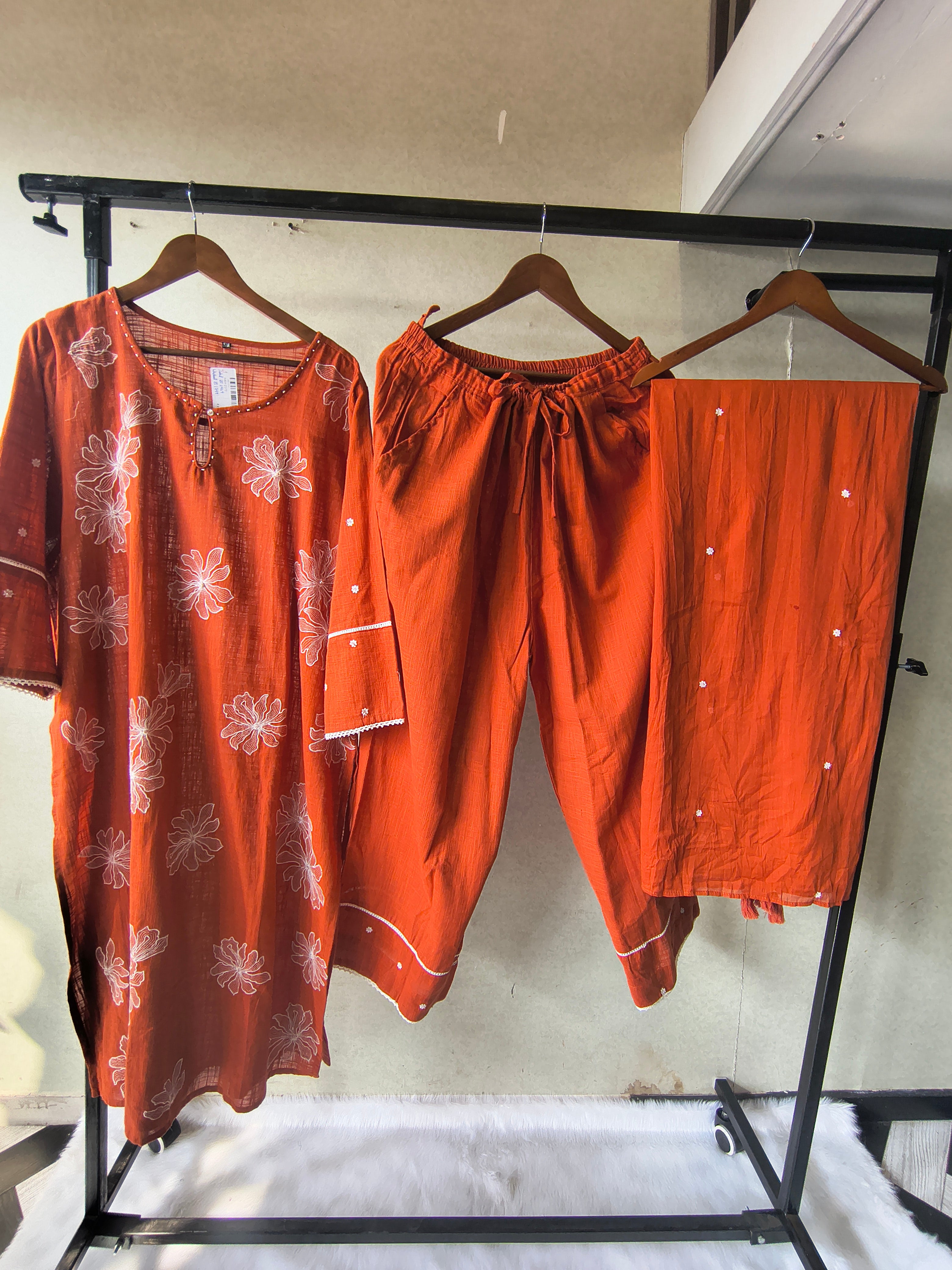 Image of Rust Orange Floral Printed Cotton Kurta Set with Solid Pants & Embroidered Dupatta