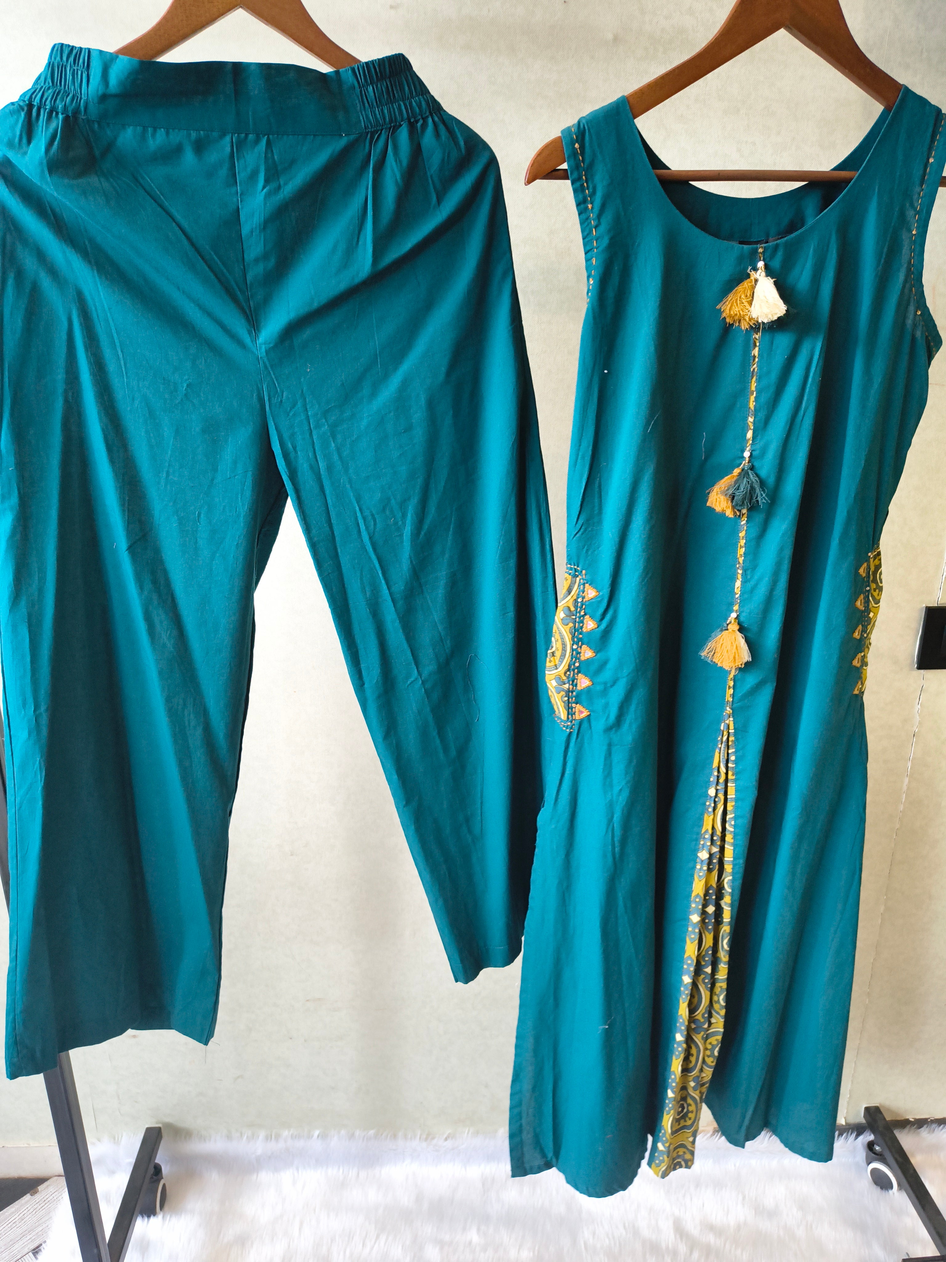 Image of Teal Sleeveless A-Line Kurta Set with Printed Panel & Straight Pants