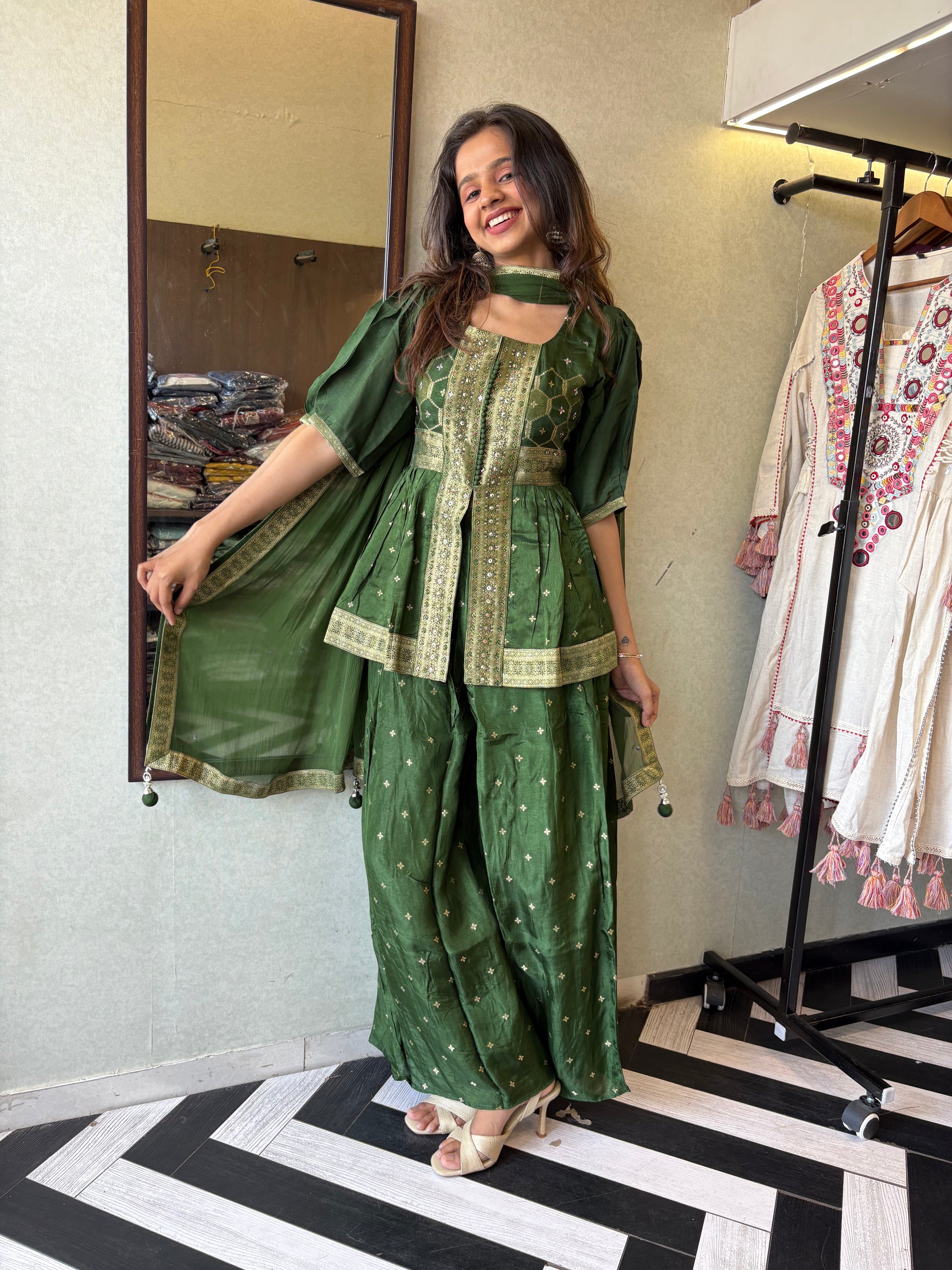 our premium pure silk 3-piece Indo-Western set in stunning green! From dazzling mirror & handwork on the jacket-style top to the flowing plazzo and dupatta