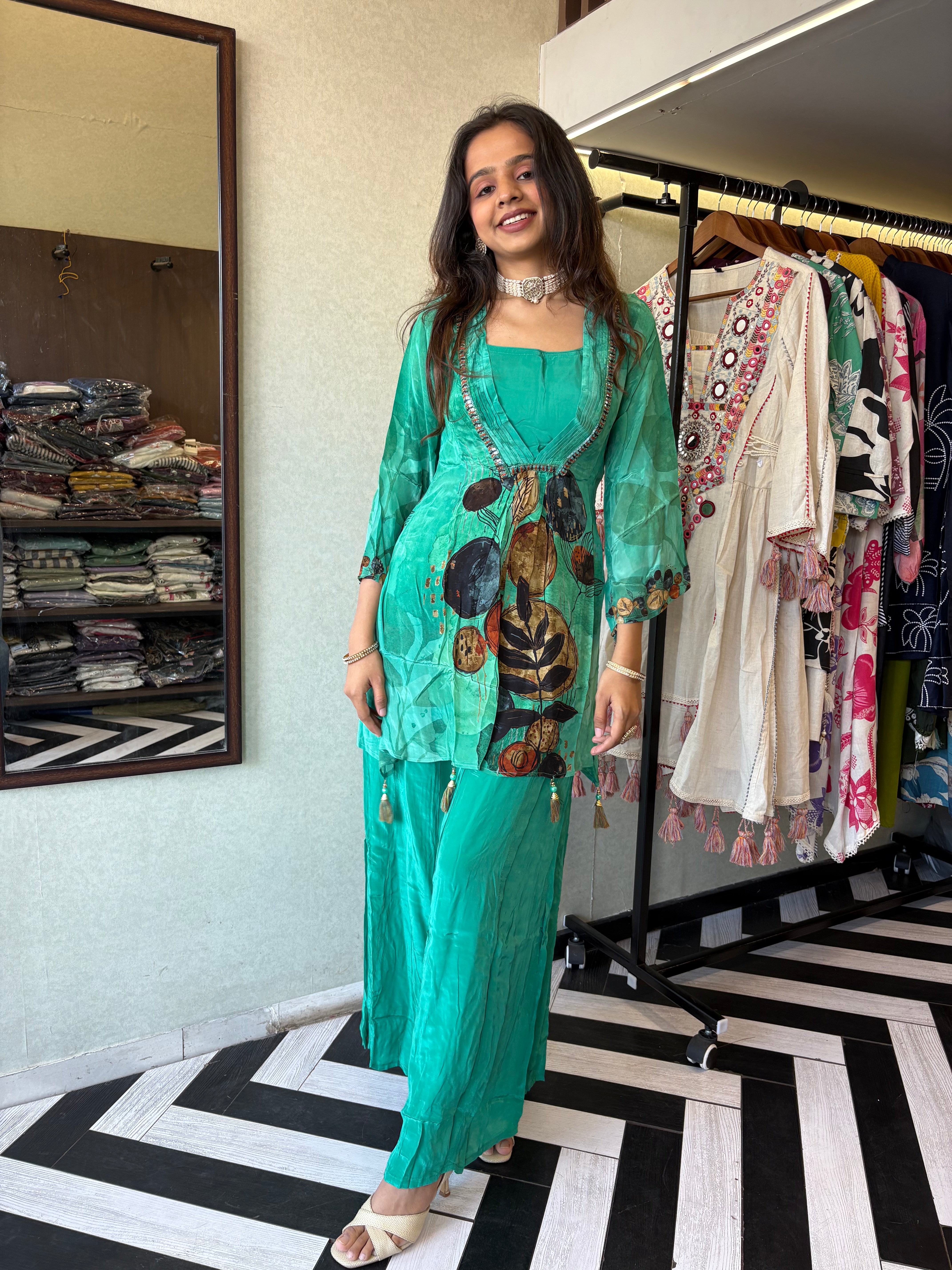 Step into the celebration with our Designer Crepe 2-Piece Set in a refreshing green hue, crafted with intricate detailing and effortless grace