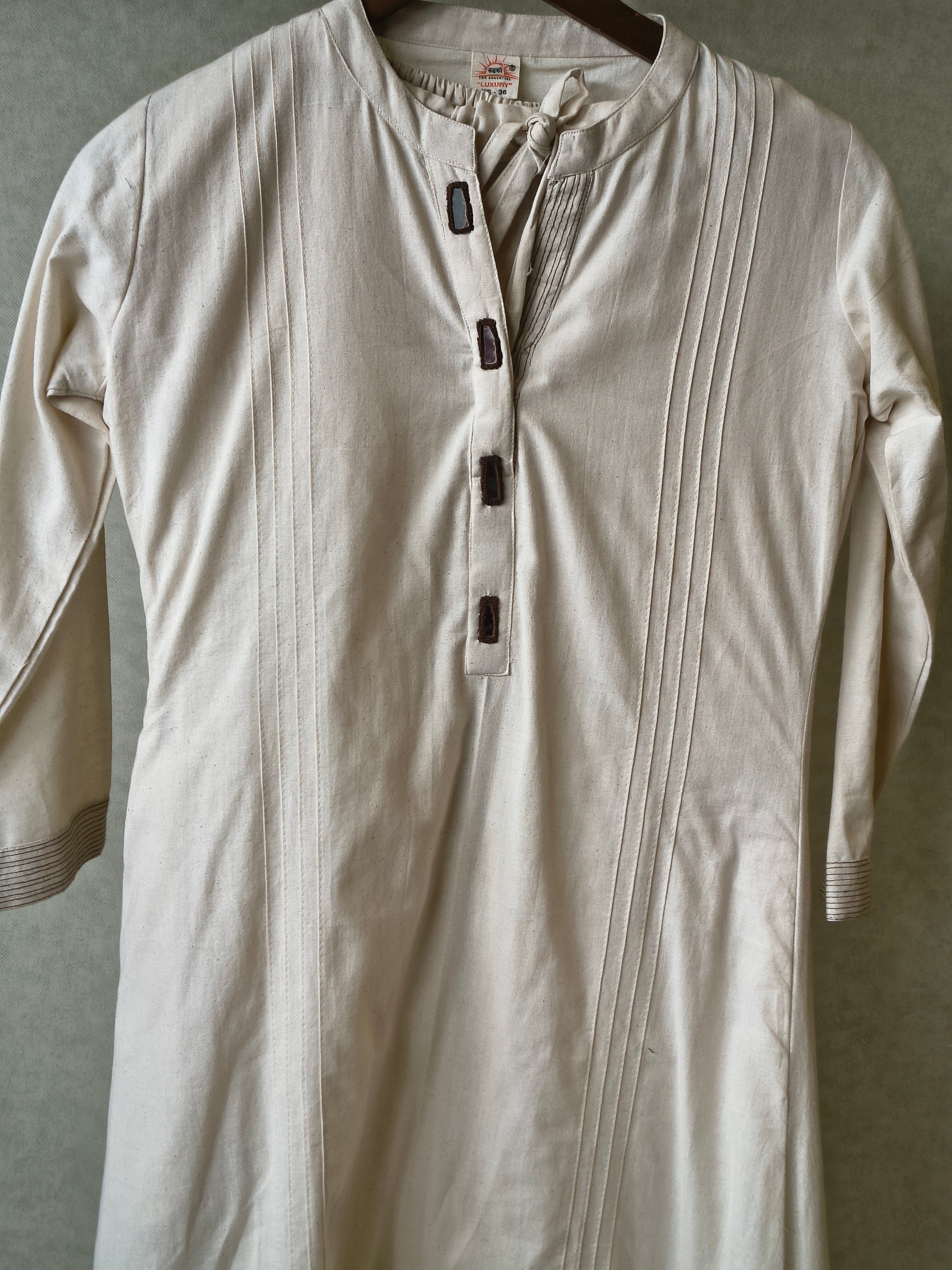 Image of Premium Off-White Cotton A-Line Kurta & Pant Co-Ord Set with Pintuck Detailing