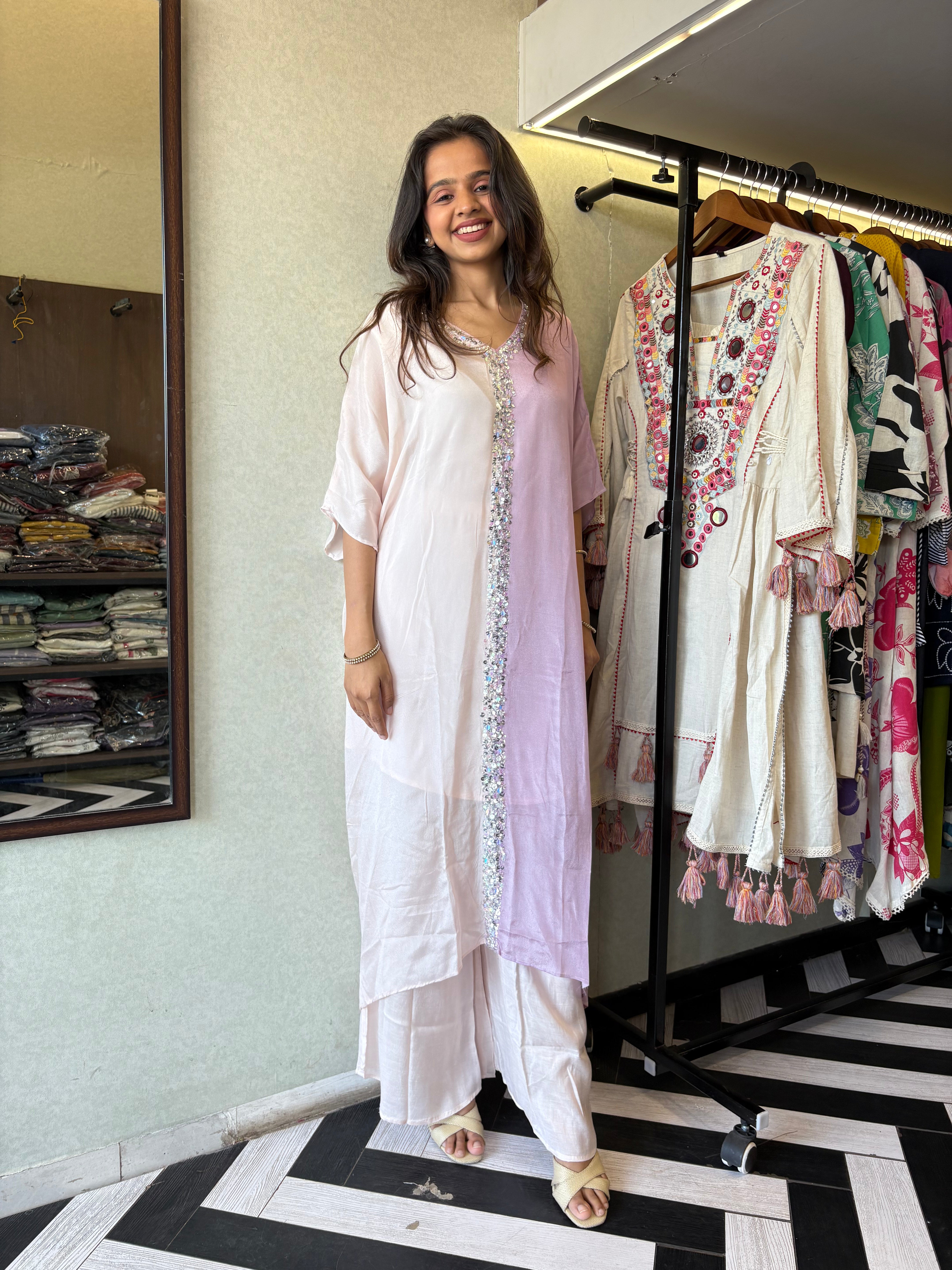 Image of Turn heads in this elegant 3-piece Indo-Western beauty crafted from pure crepe with a silk base - featuring:

Gorgeous double-shade rose color

Center hand-sequence work that glistens with grace