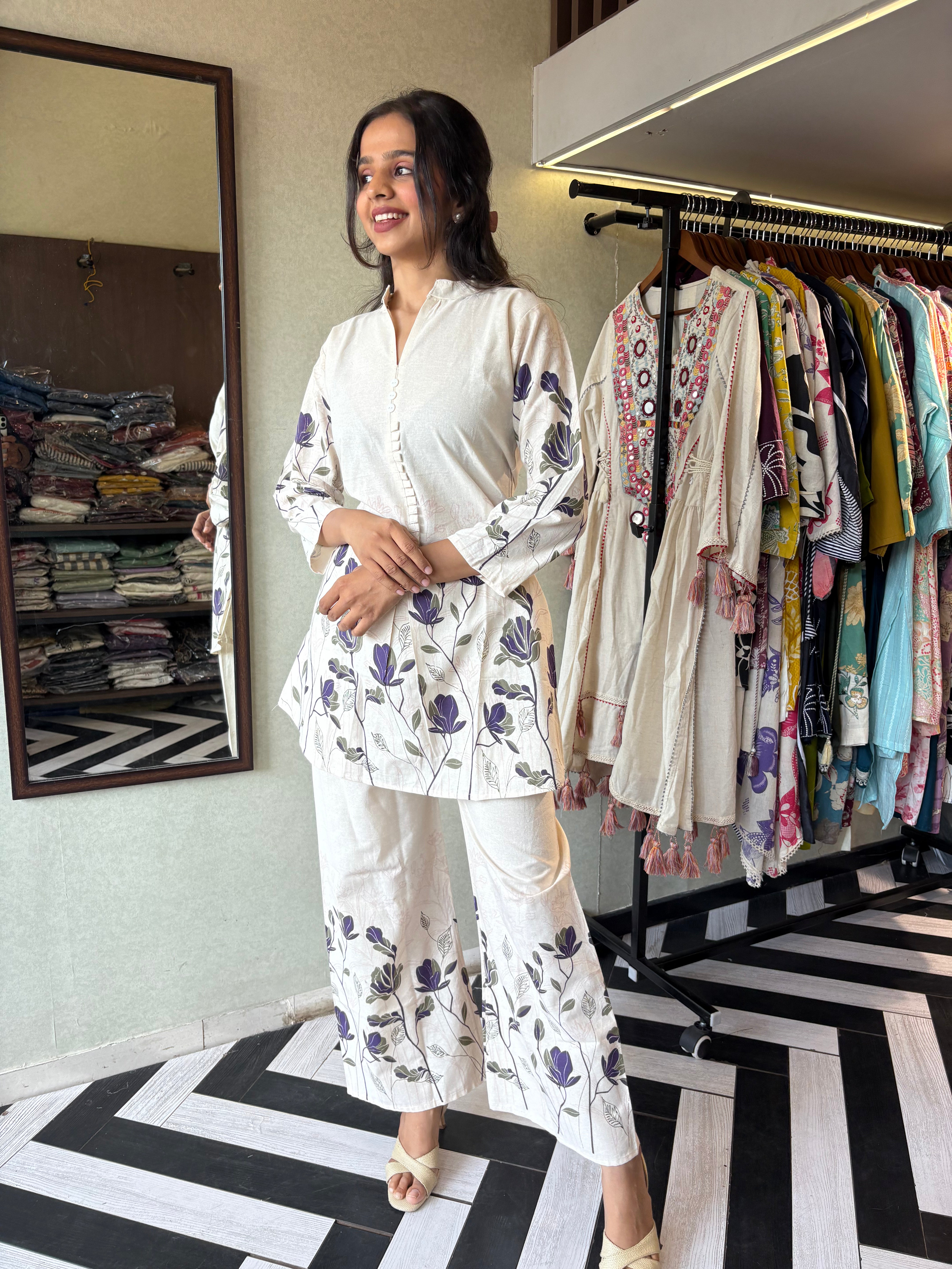 Image of This pure cotton co-ord set in a designer white print is your summer savior - soft on the skin, bold on fashion