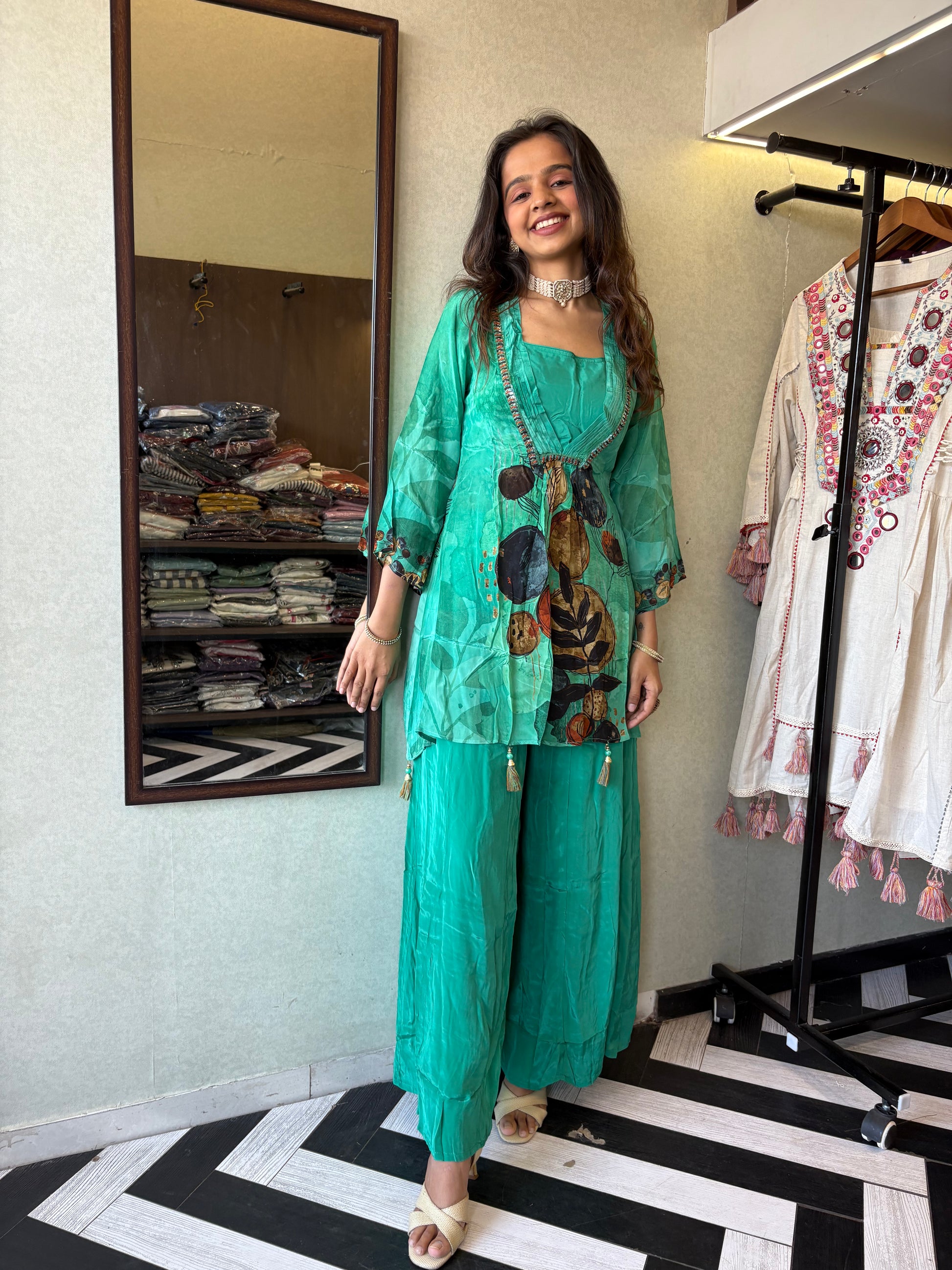 Step into the celebration with our Designer Crepe 2-Piece Set in a refreshing green hue, crafted with intricate detailing and effortless grace