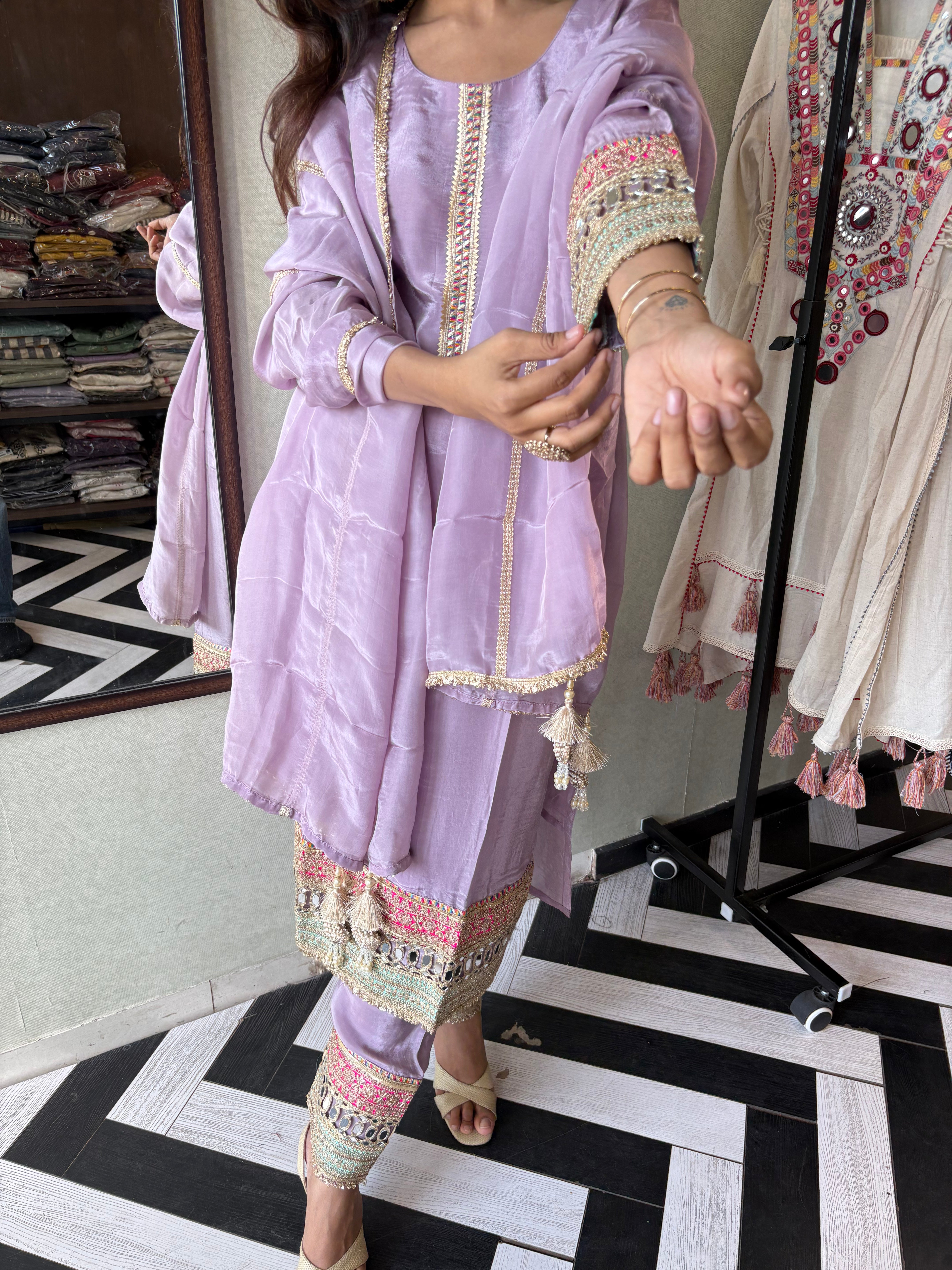 Image of Shine Bright in Royal Magenta!

Crafted in pure silk crepe, this designer straight-cut kurti set is finished with mirror handwork on sleeves and pant ends - a perfect blend of subtle glam and timeless class.