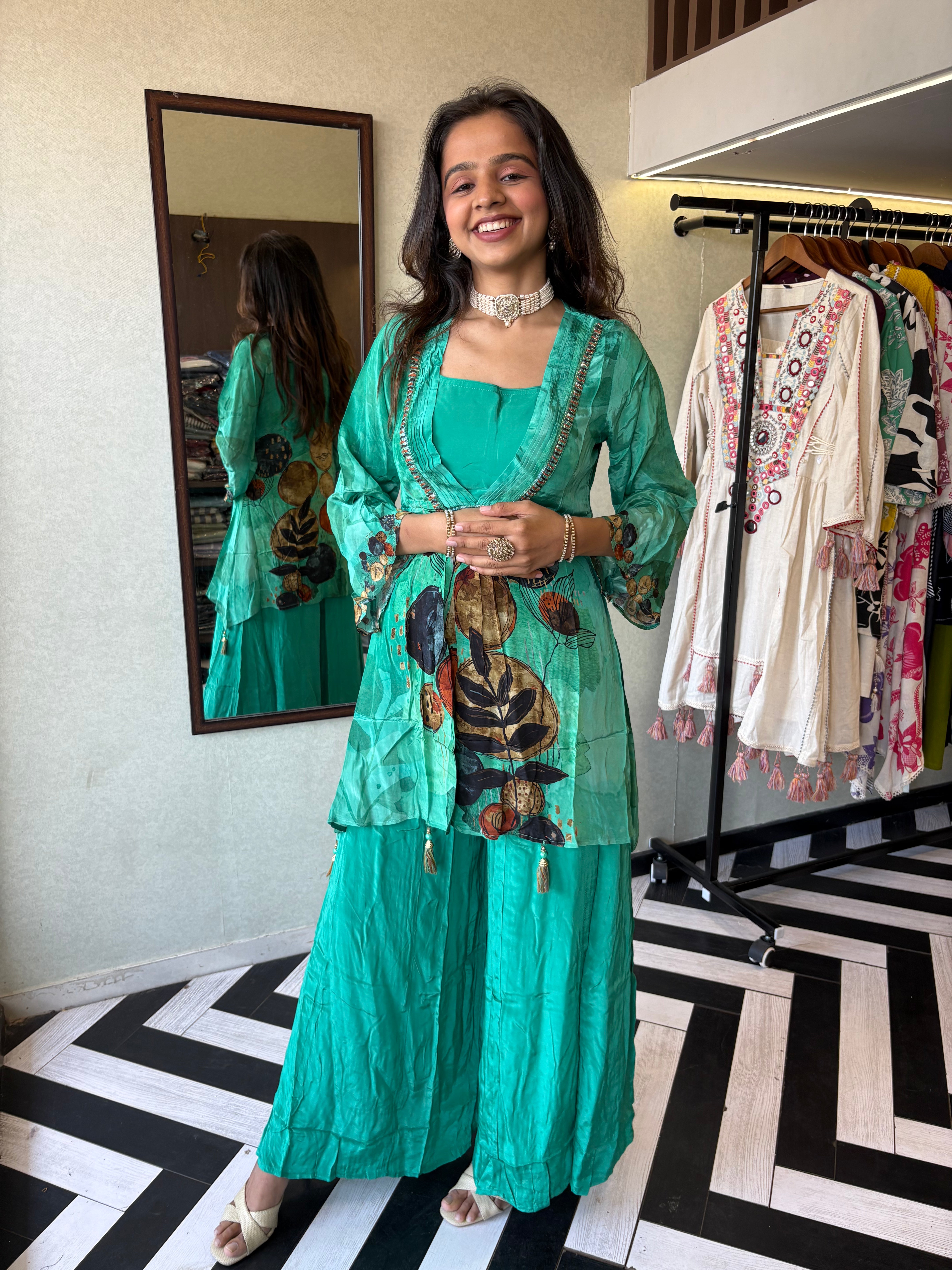 Image of Step into the celebration with our Designer Crepe 2-Piece Set in a refreshing green hue, crafted with intricate detailing and effortless grace