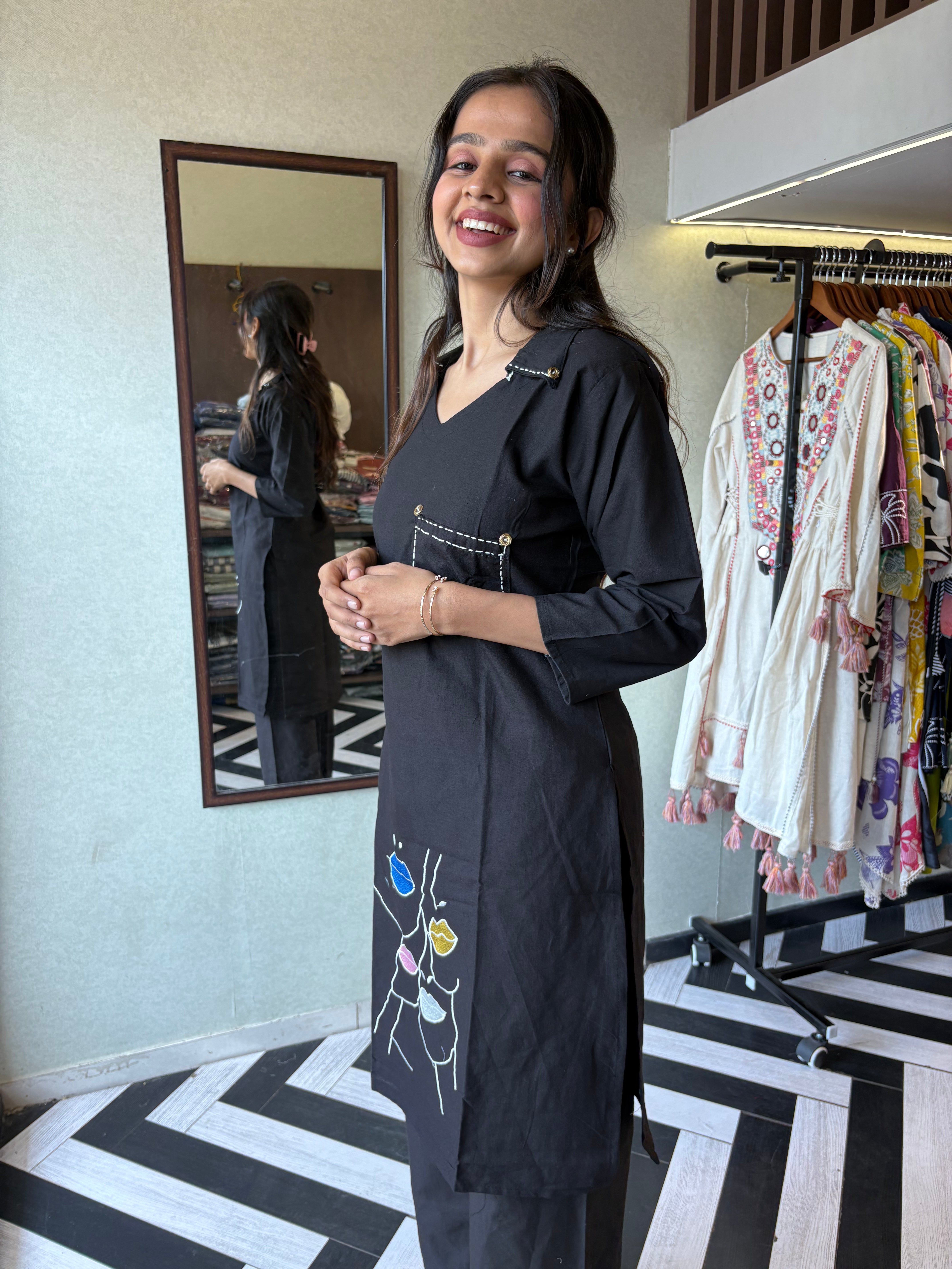 Image of pure cotton black co-ord set, elevated with elegant embroidery detailing. It's a wardrobe must-have that looks premium