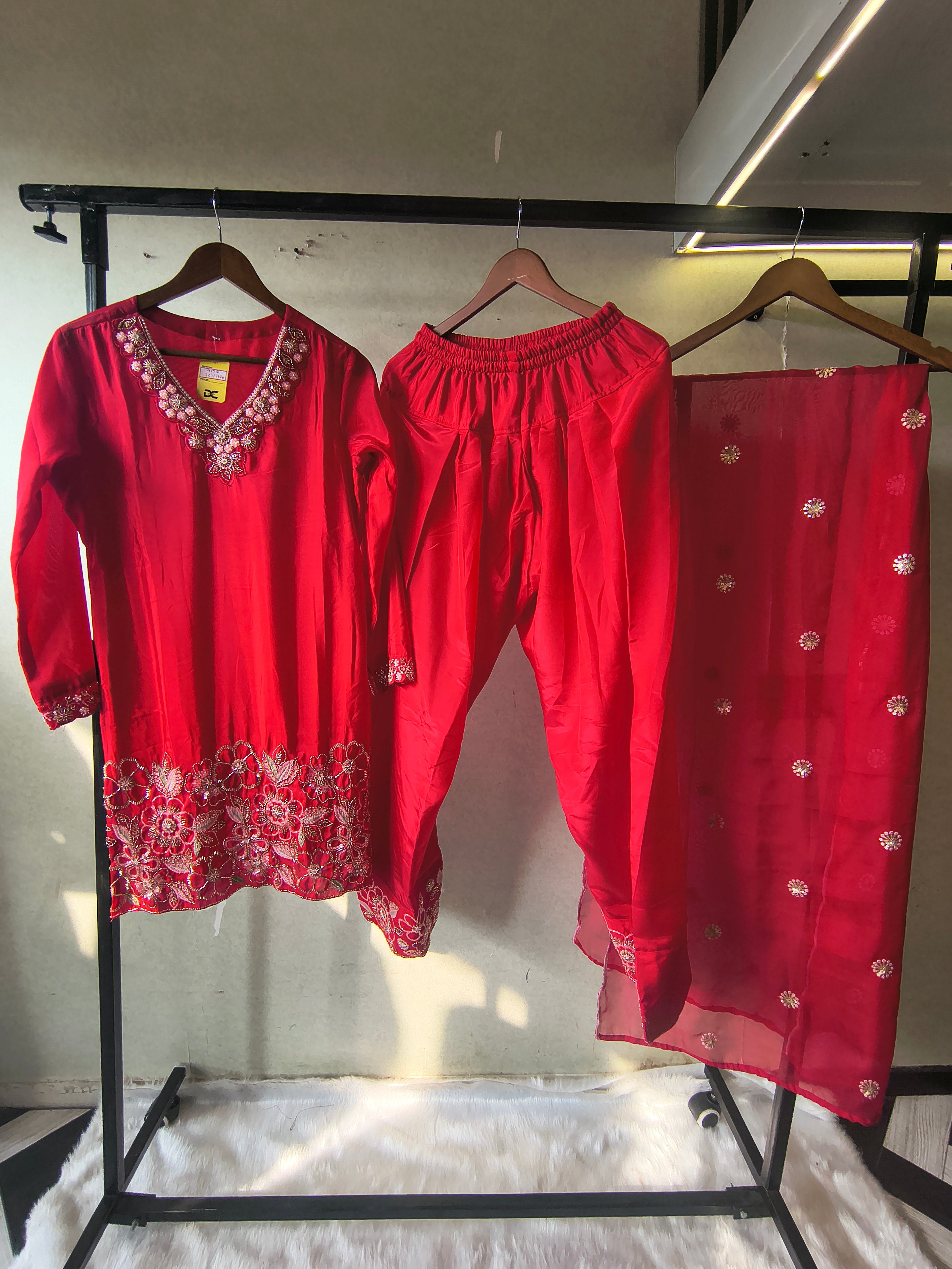 Image of Ruby Red Embroidered Straight Kurta Set with Floral Thread Work, Designer Neckline & Embellished Dupatta – Premium 3 Piece Ethnic Ensemble