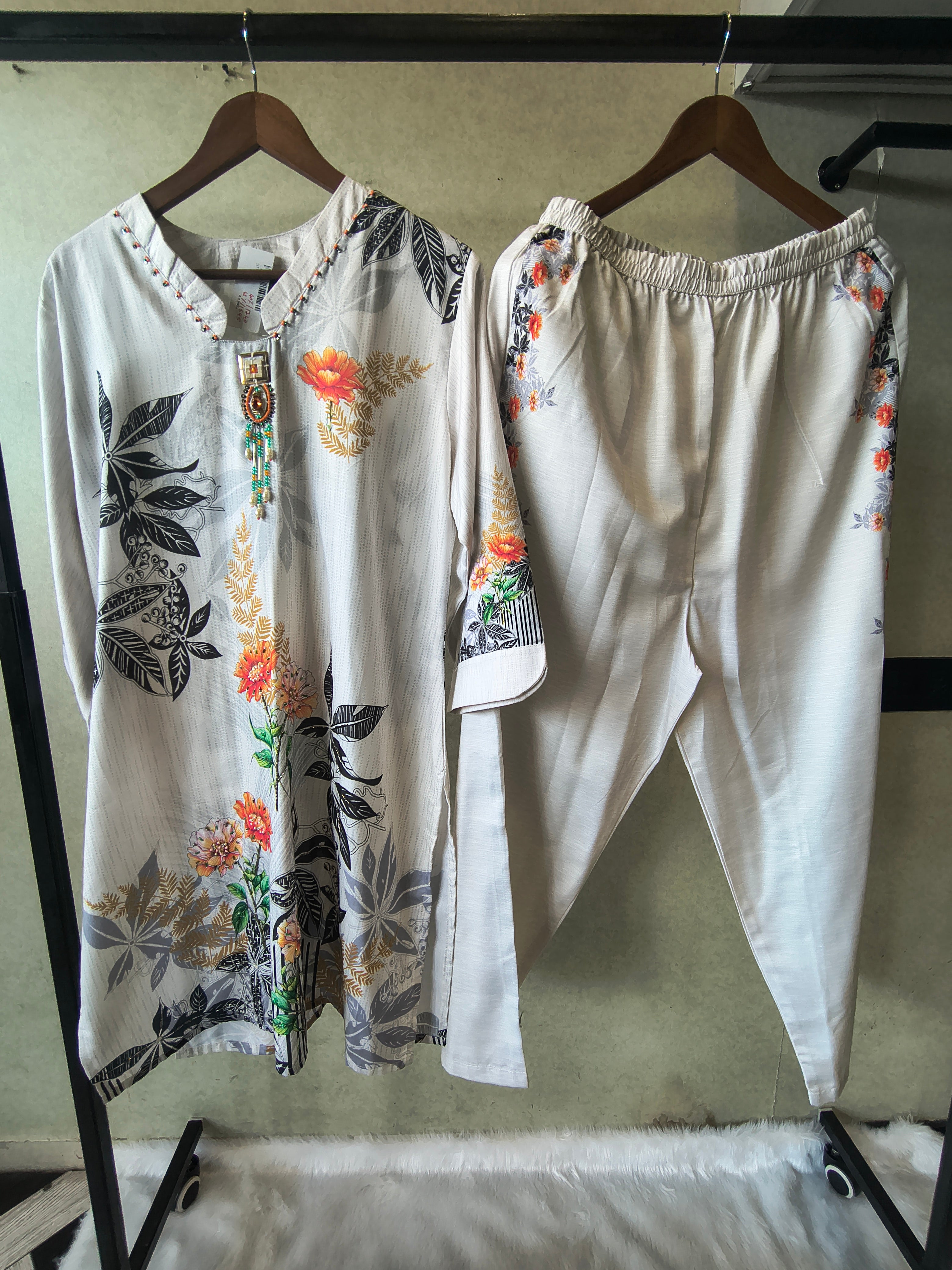 Image of Premium Ivory Botanical Printed Kurta Set with Designer Pendant Neckline
